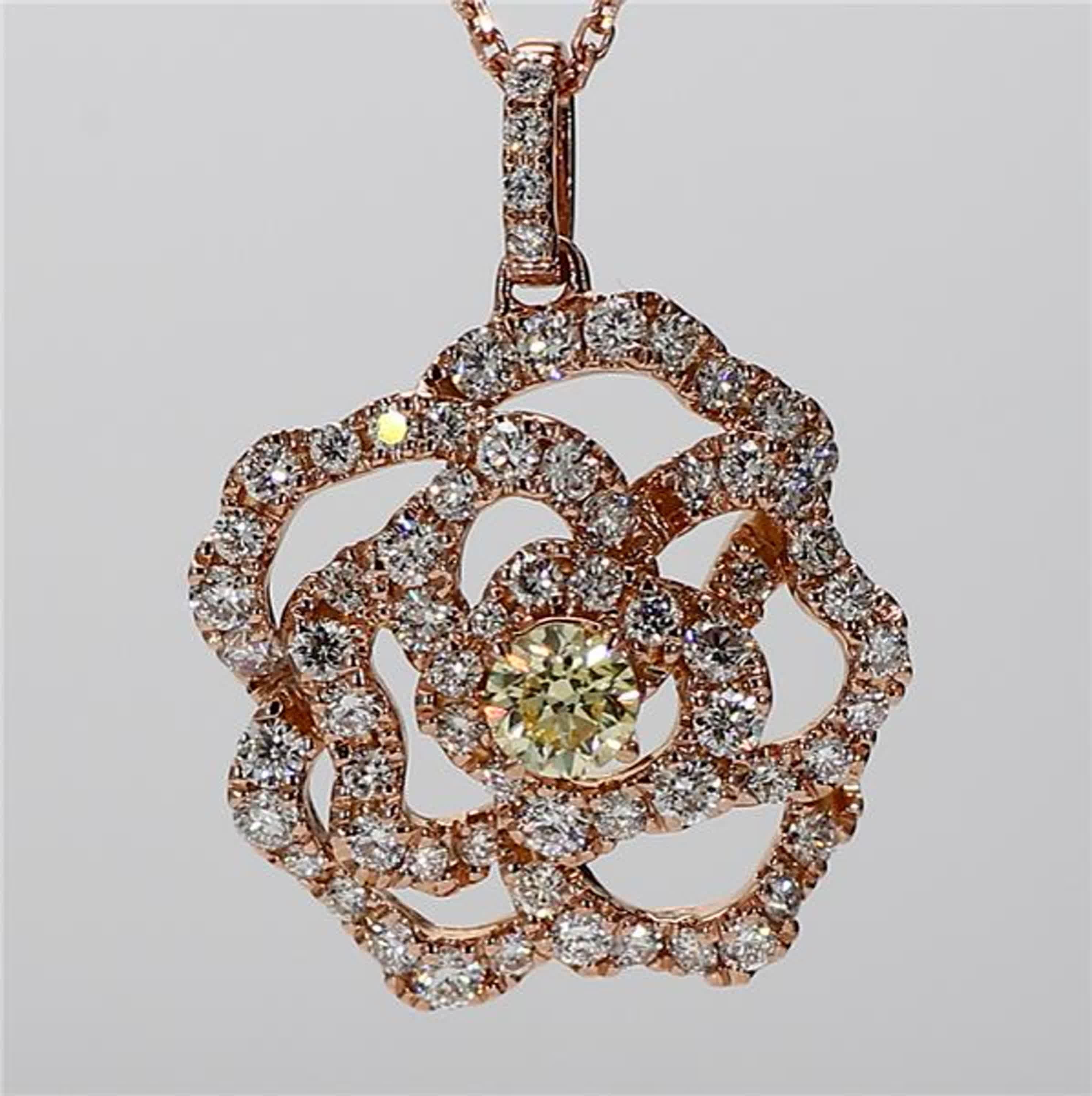 RareGemWorld's classic diamond pendant. Mounted in a beautiful 18K Rose Gold setting with a natural round yellow diamond. The yellow diamond is surrounded by natural round white diamond melee. This pendant is guaranteed to impress and enhance your