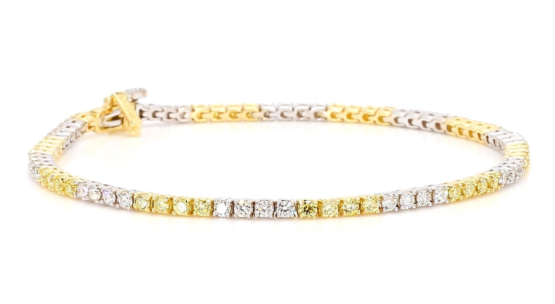 RareGemWorld's beautiful diamond bracelet. Mounted in a beautiful 18K Yellow and White Gold setting with natural round cut yellow diamond melee complimented by natural round cut white diamond melee. This bracelet is guaranteed to impress and will
