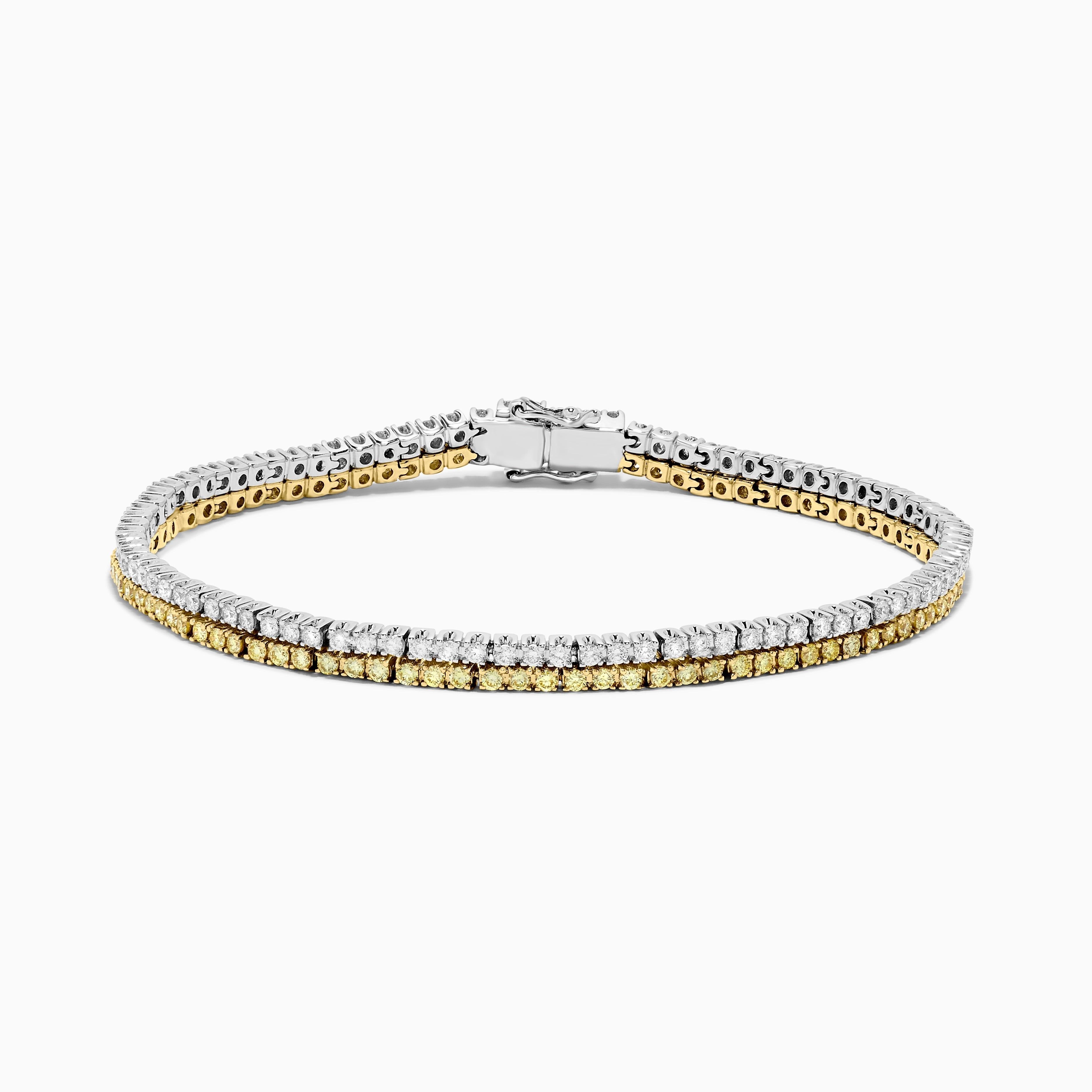RareGemWorld's classic diamond bracelet. Mounted in a beautiful 18K Yellow and White Gold setting with natural round cut yellow diamond melee complimented by natural round cut white diamond melee. This bracelet is guaranteed to impress and will