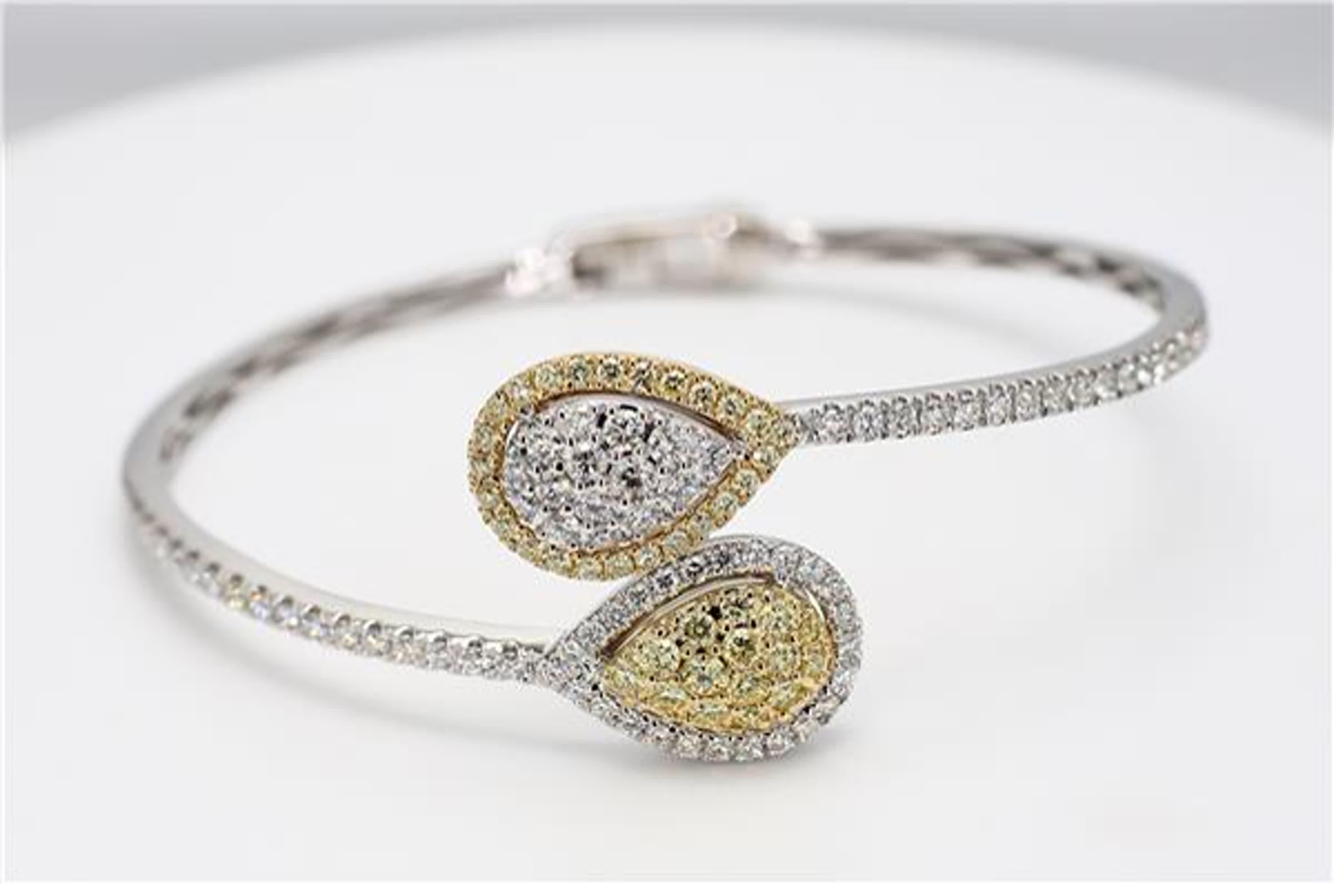 RareGemWorld's classic diamond bracelet. Mounted in a beautiful 18K Yellow and White Gold setting with natural round cut yellow diamonds. The yellow diamonds are complimented by small round natural white diamond melee. This bracelet is guaranteed to