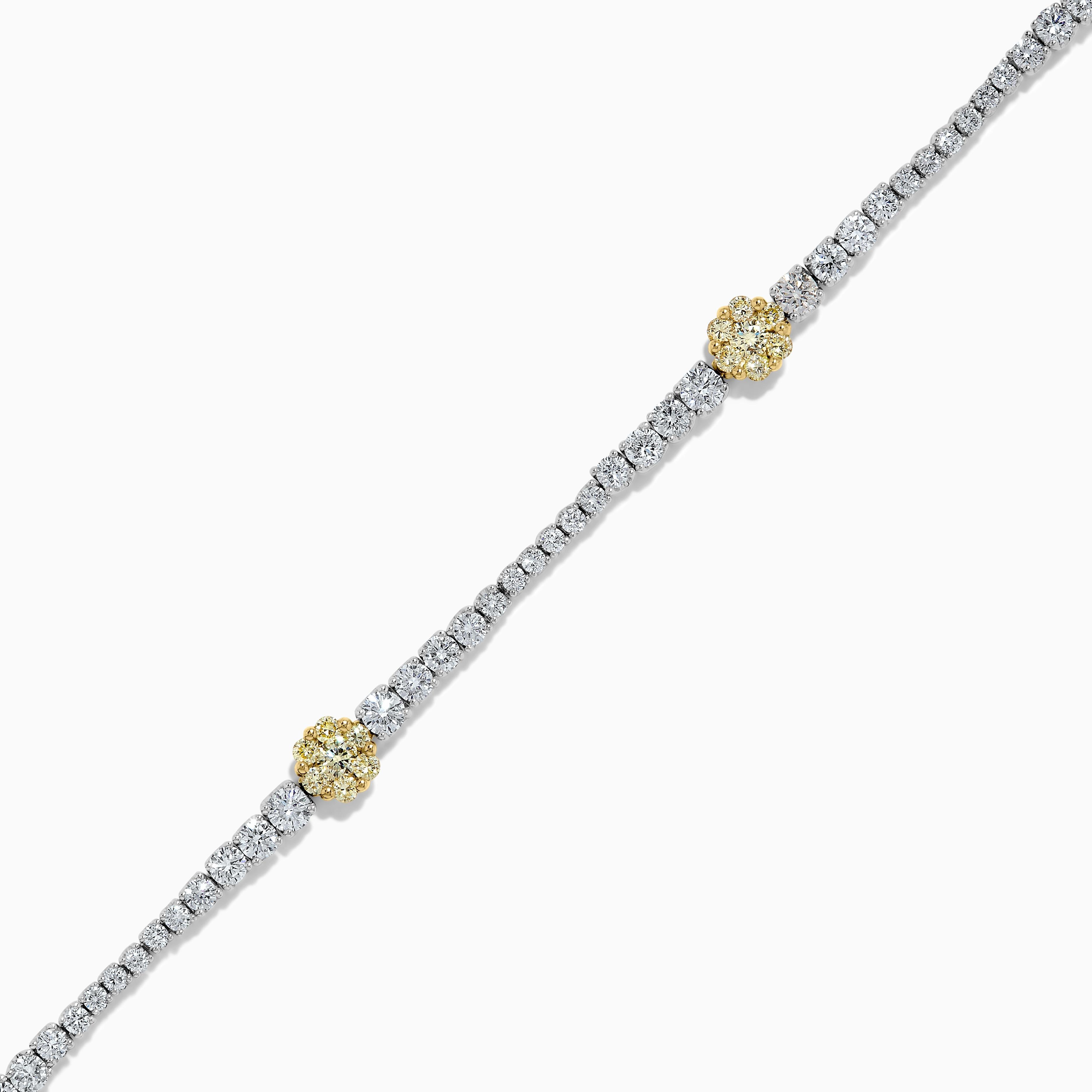 RareGemWorld's classic natural round cut yellow diamond bracelet. Mounted in a beautiful 18K Yellow and White Gold setting with clusters of natural round cut yellow diamonds. The yellow diamonds are surrounded by small round natural white diamond
