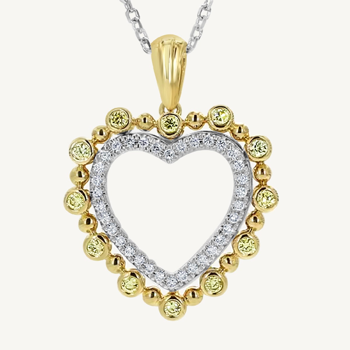 Natural Yellow Round and White Diamond .38 Carat TW Gold Heart Pendant For Sale