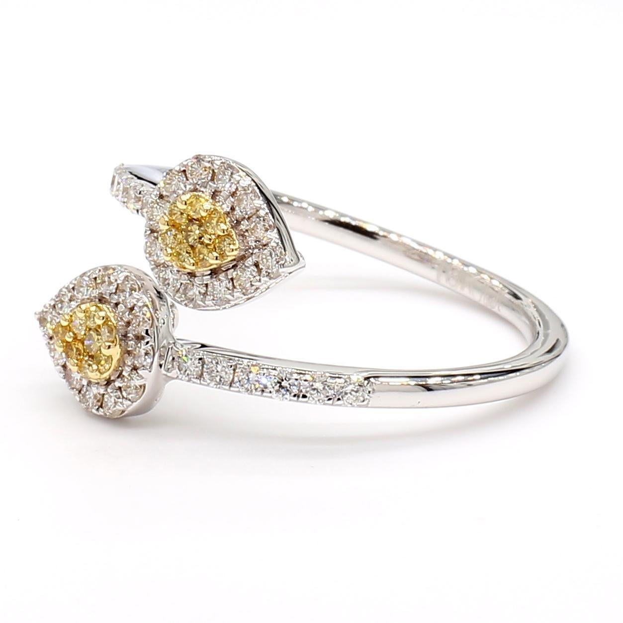 RareGemWorld's beautiful diamond ring. Mounted in a beautiful 18K Yellow and White Gold setting with a natural round cut yellow diamond melee complimented by round natural white diamond melee. This ring is guaranteed to impress and enhance your