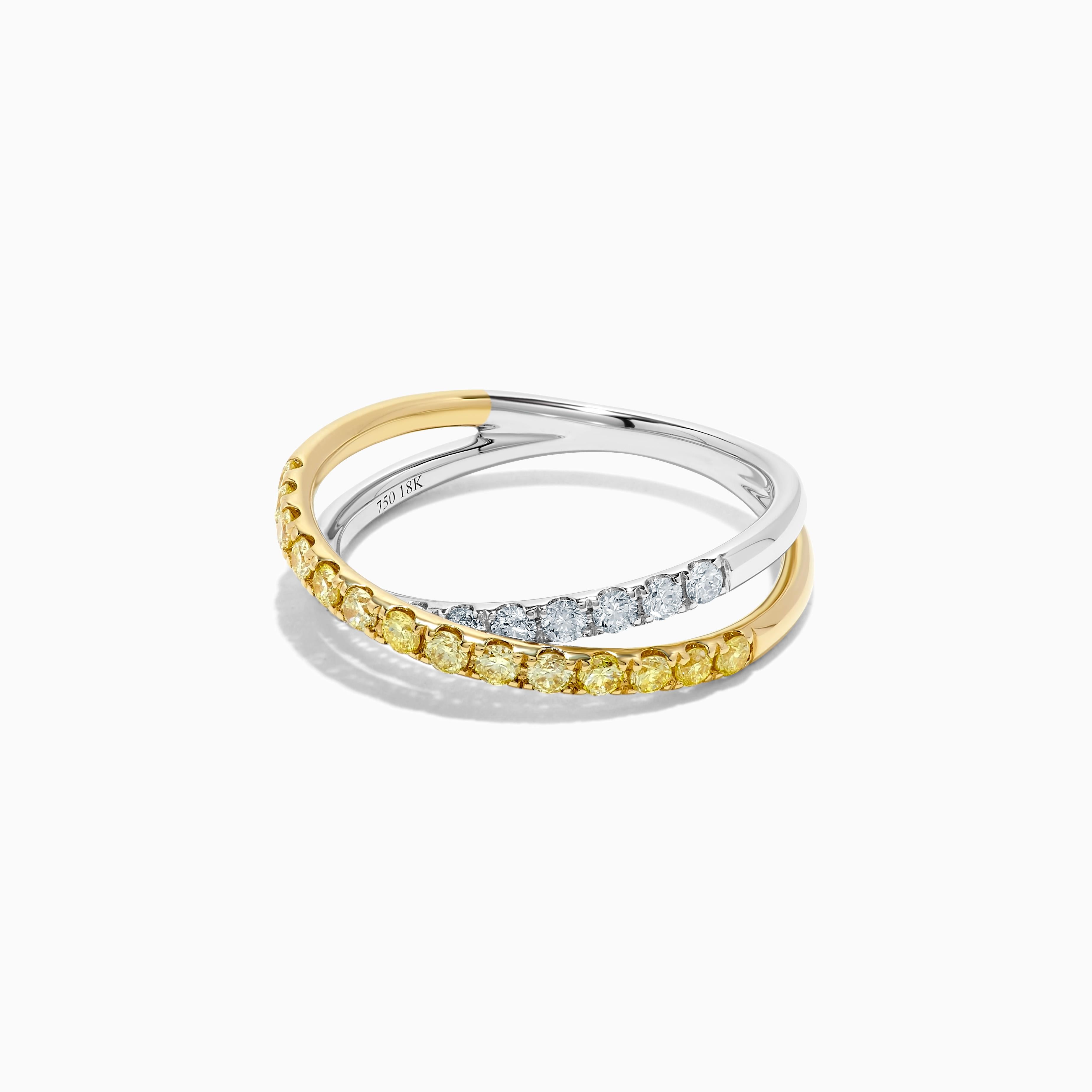 RareGemWorld's classic diamond band. Mounted in a beautiful 18K Yellow and White Gold setting with natural round yellow diamond melee complimented by natural round white diamond melee. This band is guaranteed to impress and enhance your personal