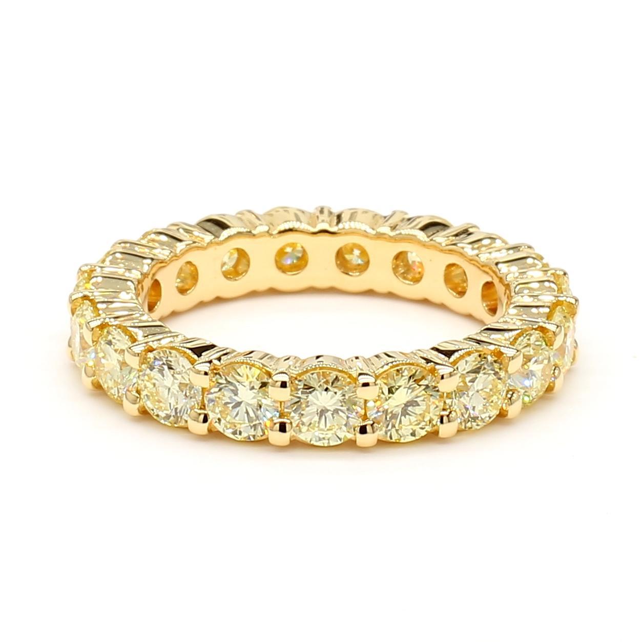 RareGemWorld's beautiful diamond eternity band. Mounted in a beautiful 18K Yellow Gold setting with natural round cut yellow diamonds. This band is guaranteed to impress and enhance your personal collection!

Total Weight: 2.55cts

Natural Round