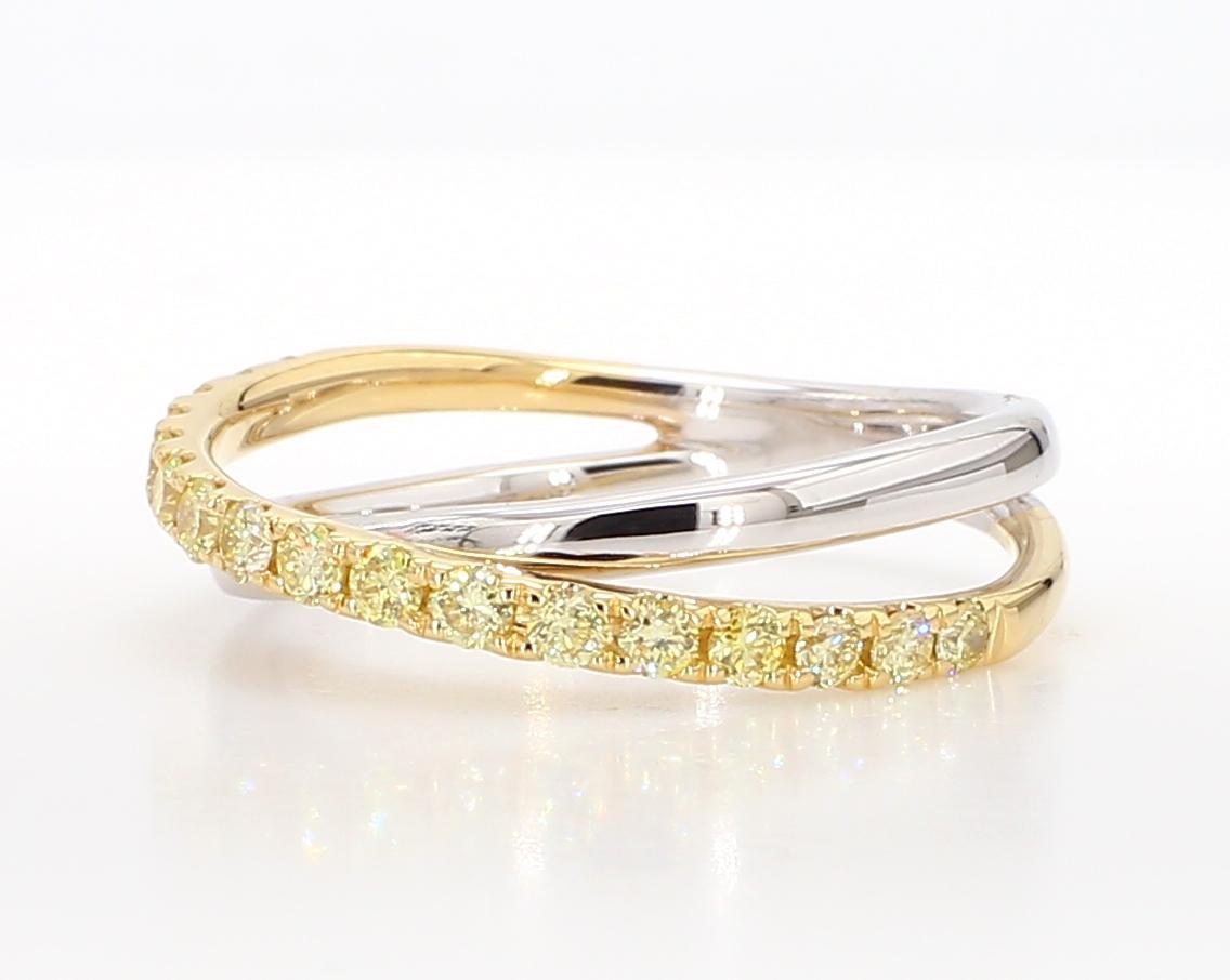 RareGemWorld's classic diamond band. Mounted in a beautiful 18K Yellow/White Gold setting with natural round yellow diamond melee. This band is guaranteed to impress and enhance your personal collection!

Total Weight: .47cts

Length x Width: 21.1 x