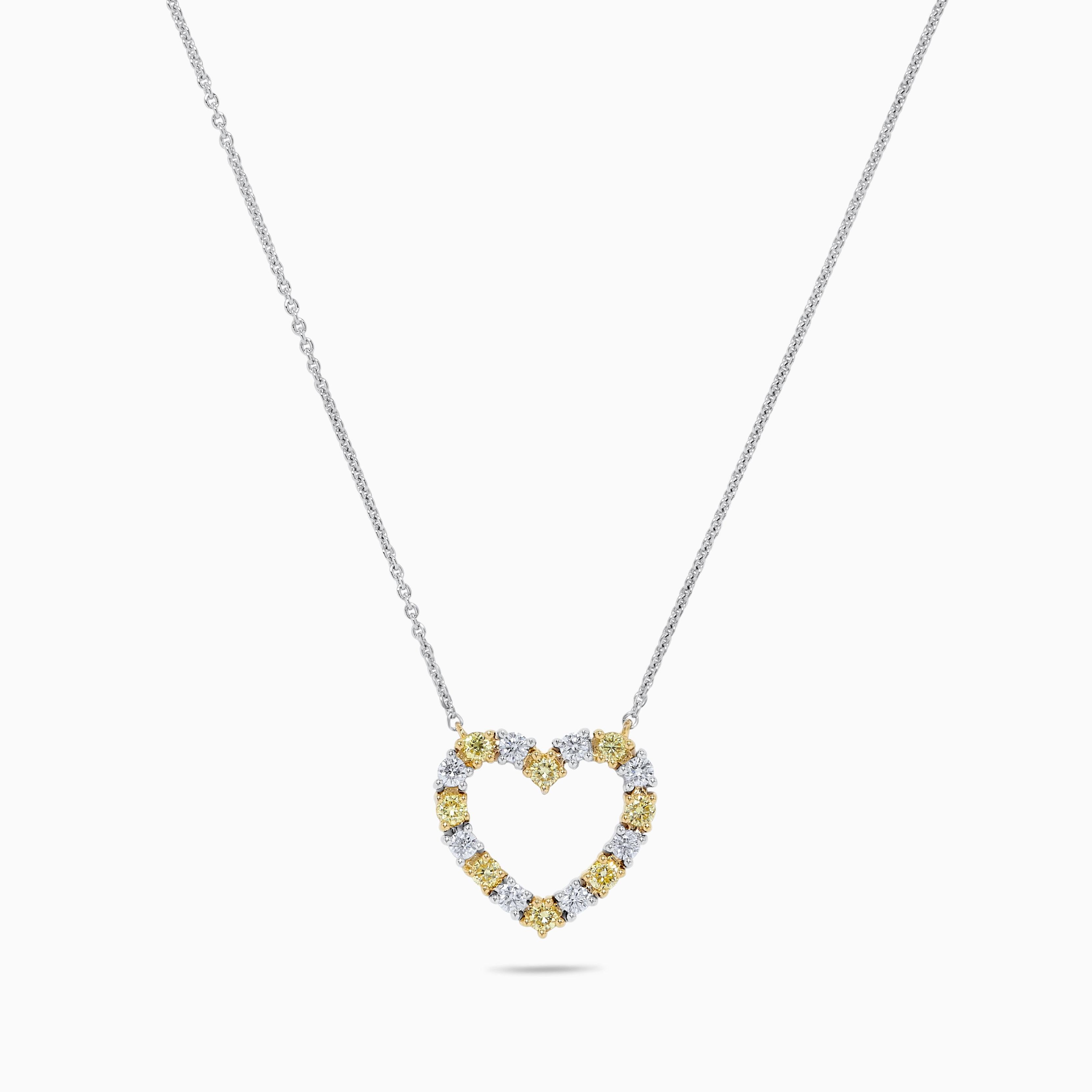 Contemporary Natural Yellow Round Diamond .63 Carat TW Gold Heart Necklace For Sale