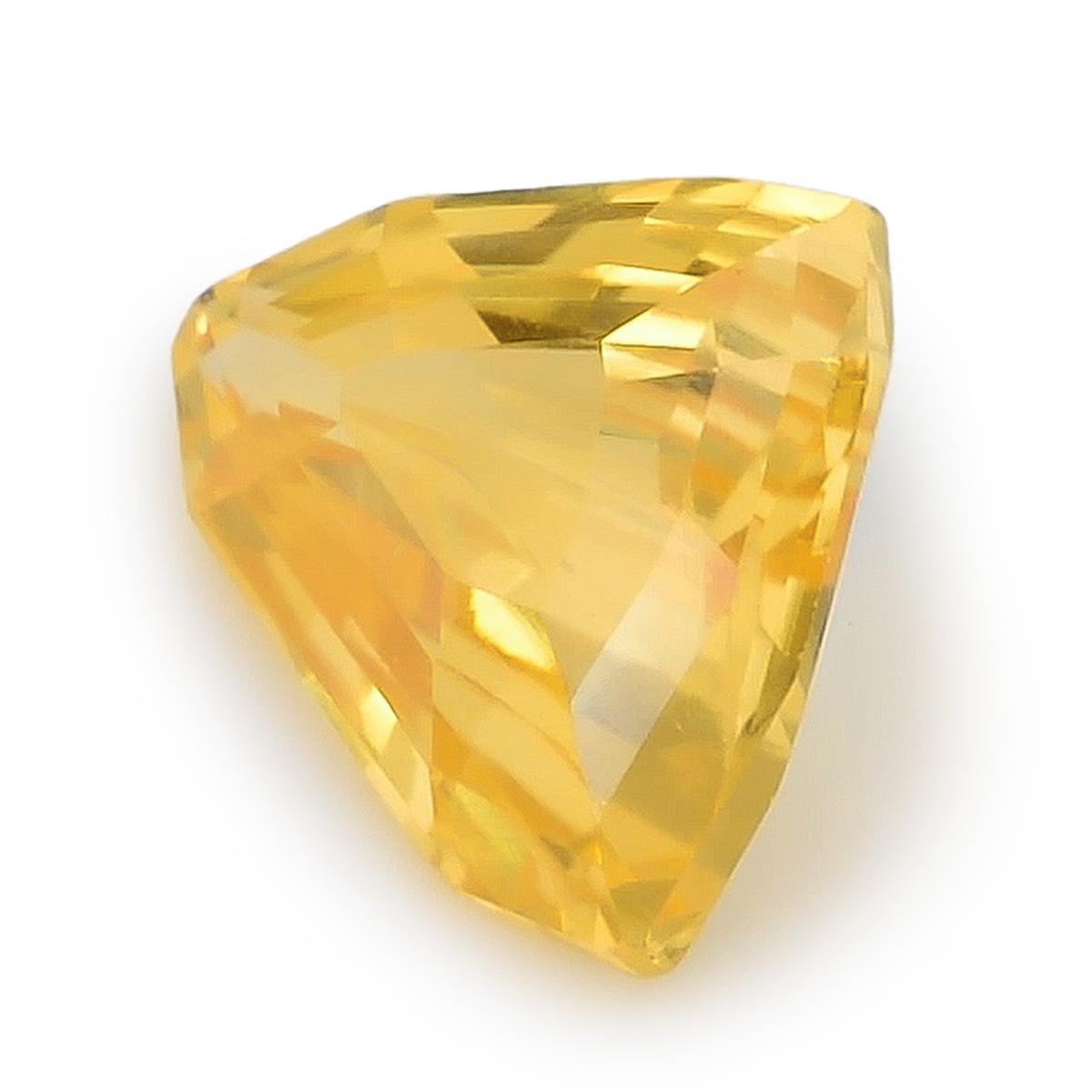 Dive into the captivating world of 1.67 carats Natural Yellow Sapphire from Sri Lanka. This gem's unique triangular shape measures 7.09 x 8.57 x 3.91 mm, showcasing its radiant yellow hue that symbolizes positivity and energy. With its very clean