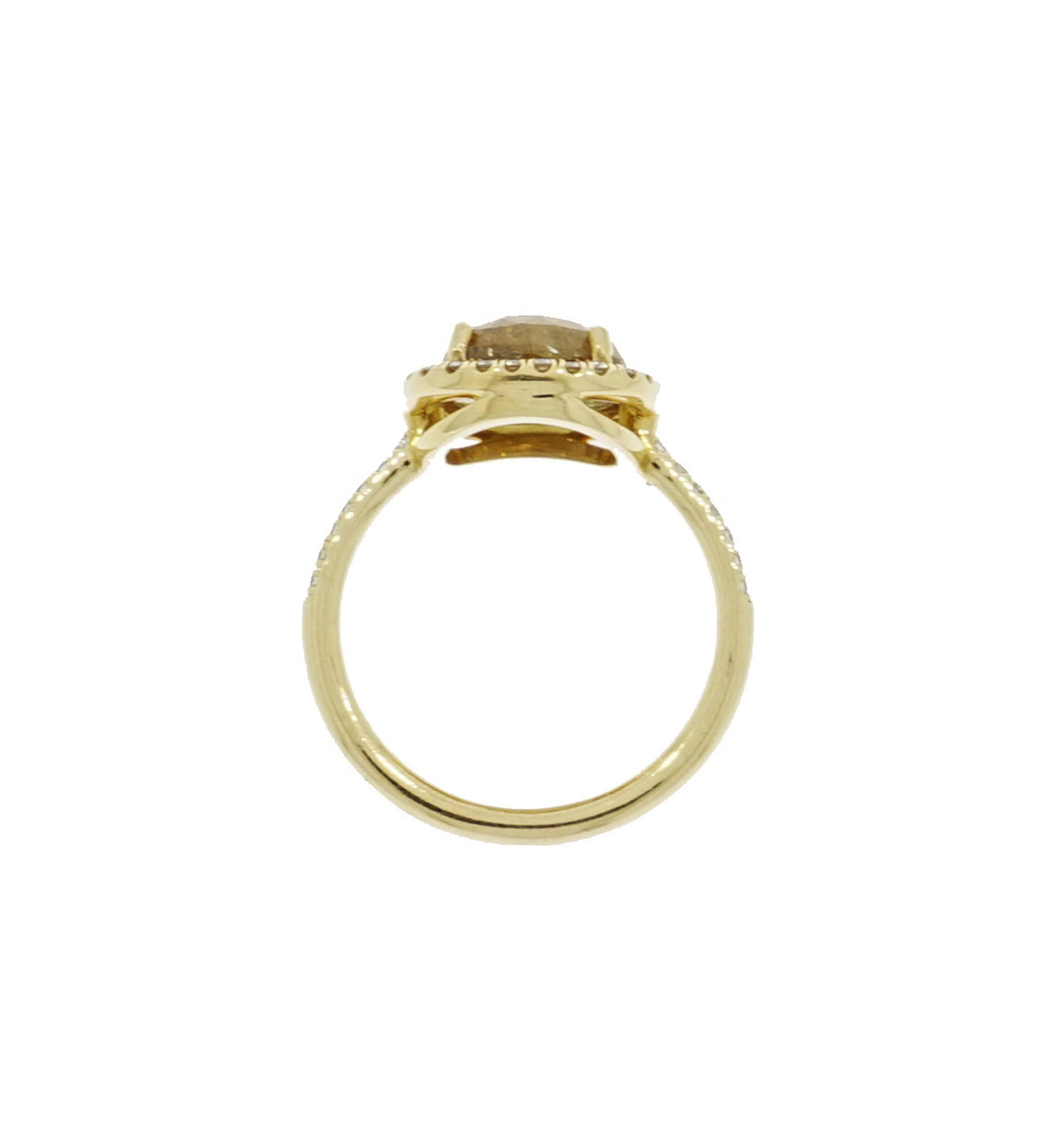 Unique and one of a kind... this cushion shaped Natural Yellow Sapphire is a fresh and youthful look that takes this oft-forgotten shade and is elevated with a perfect yellow gold frame of white diamonds.
Designed and created in NYC for a finger