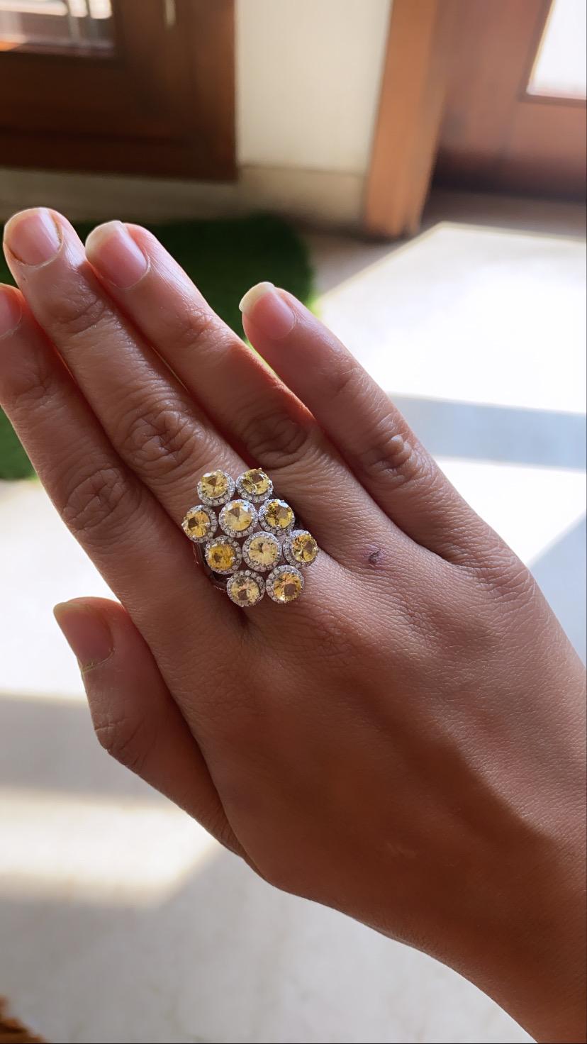 A beautiful cocktail ring set in 18k white gold with yellow sapphire and diamonds . The yellow sapphire weight is 5.13 carats , diamond weight is .67 carats and net gold weight is 10.995 grams. The ring dimensions in cm 2.8 x 2 x 2.5 (LXWXH). US