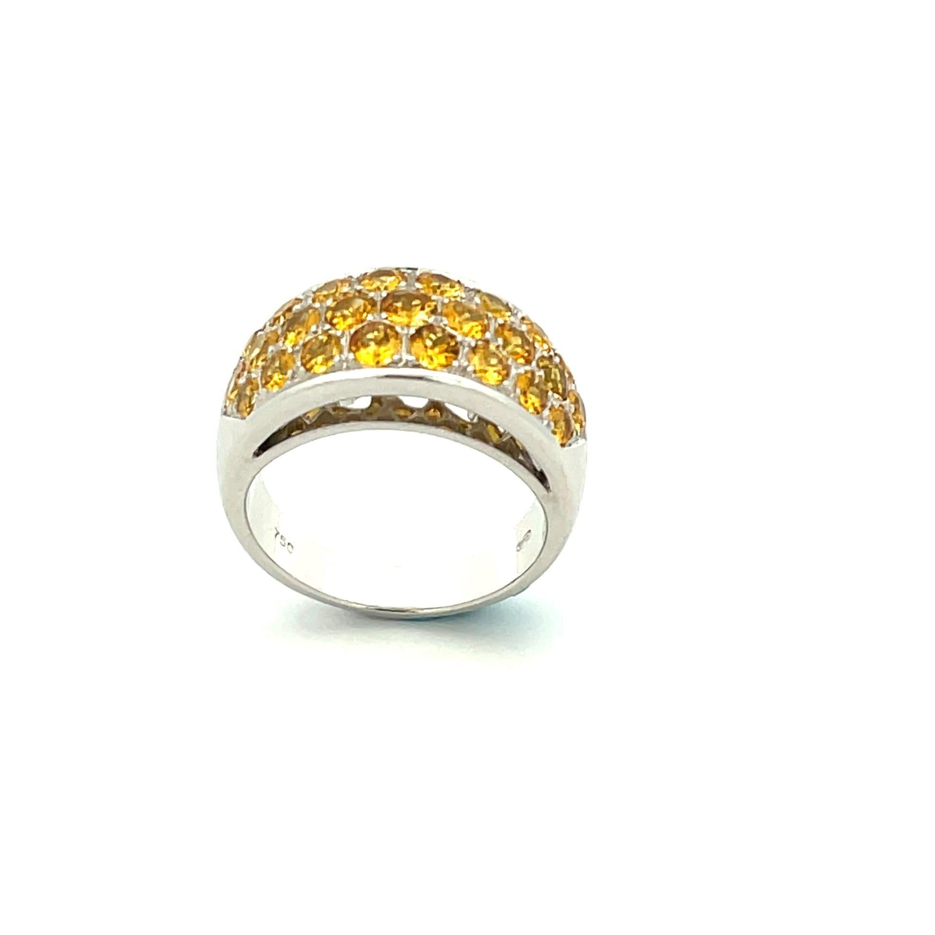 Yellow Sapphire are wonderfully set on a elegant and sparkling 18 karat white gold. Wear this pave ring as an anniversary ring or even as a right hand fashion ring.

25 natural yellow sapphires  2.70ct total weight

18kt white gold weighing 10.20