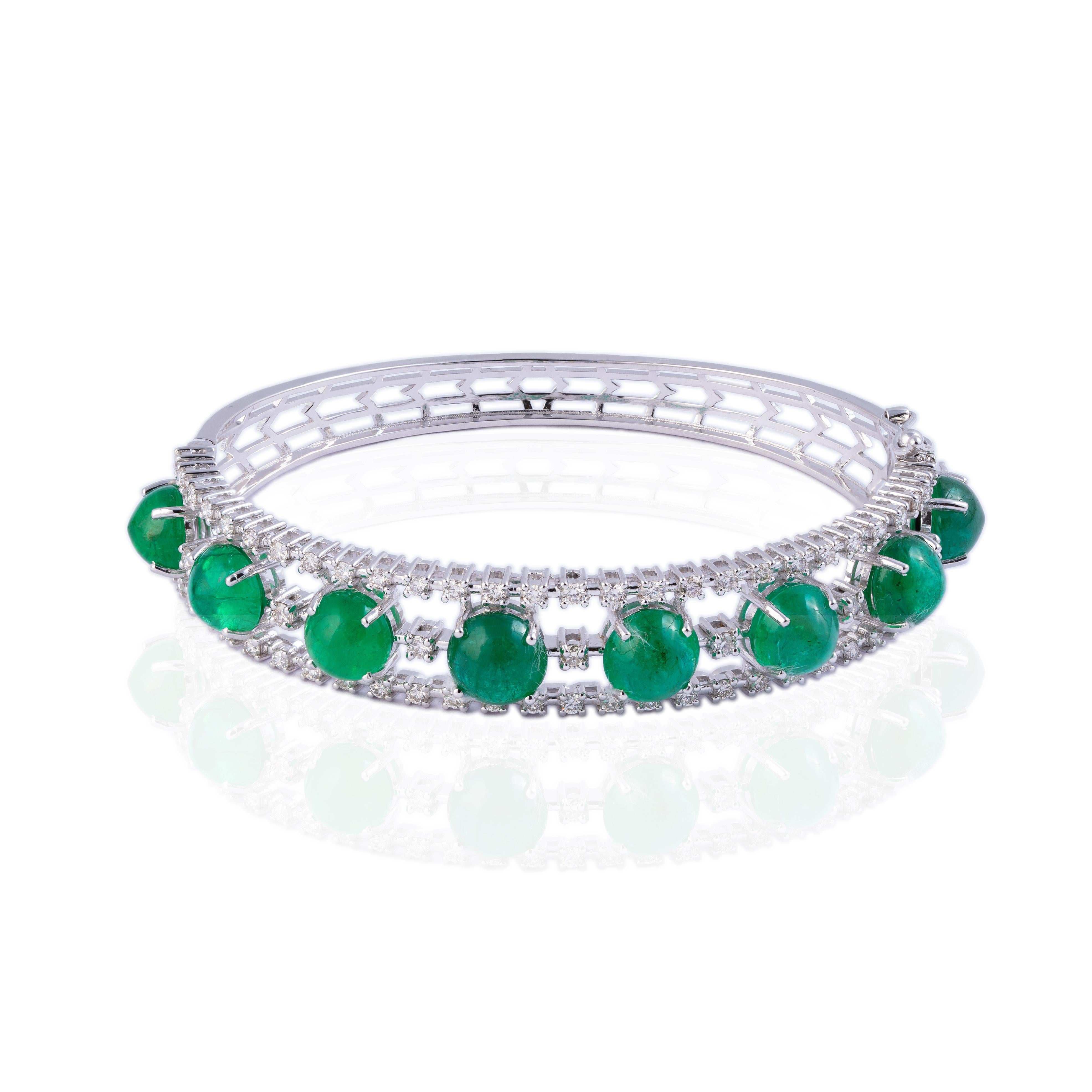 This is a very elegant natural emerald and diamond bracelet in 14k gold. the emeralds are caboshans of very high quality
emeralds: 15.18cts
diamonds : 1.59cts
gold : 17.49gms 
very hard to capture the true color and luster of the stone, I have tried