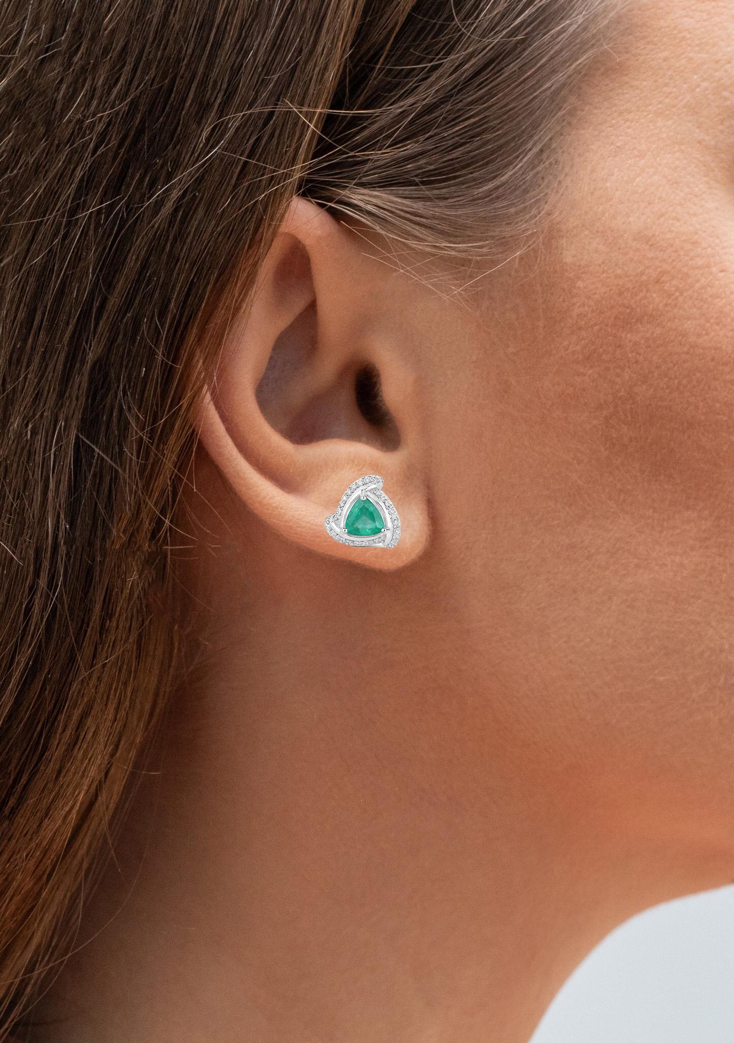It comes with the appraisal by GIA GG/AJP
All Gemstones are Natural  
2 Trillion Cut Emeralds = 1.02 Carats 
66 Diamonds = 0.22 Carats
Metal: 14K White Gold
Length: 11 mm
