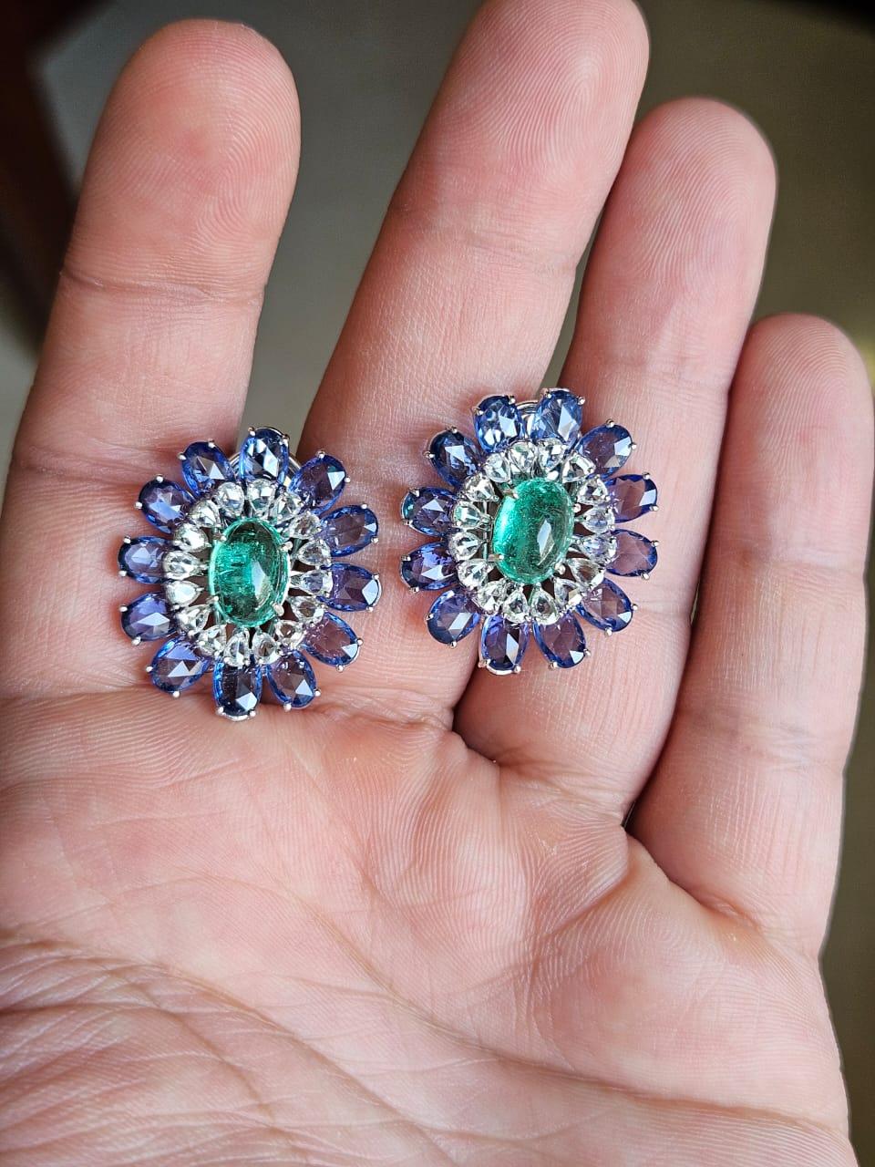 A very gorgeous and beautiful, Emerald & Blue Sapphire Stud Earrings set in 18K White Gold & Diamonds. The weight of the Emerald cabochon is 3.72 carats. The Emeralds are completely natural, without any treatment and are of colombian origin. The