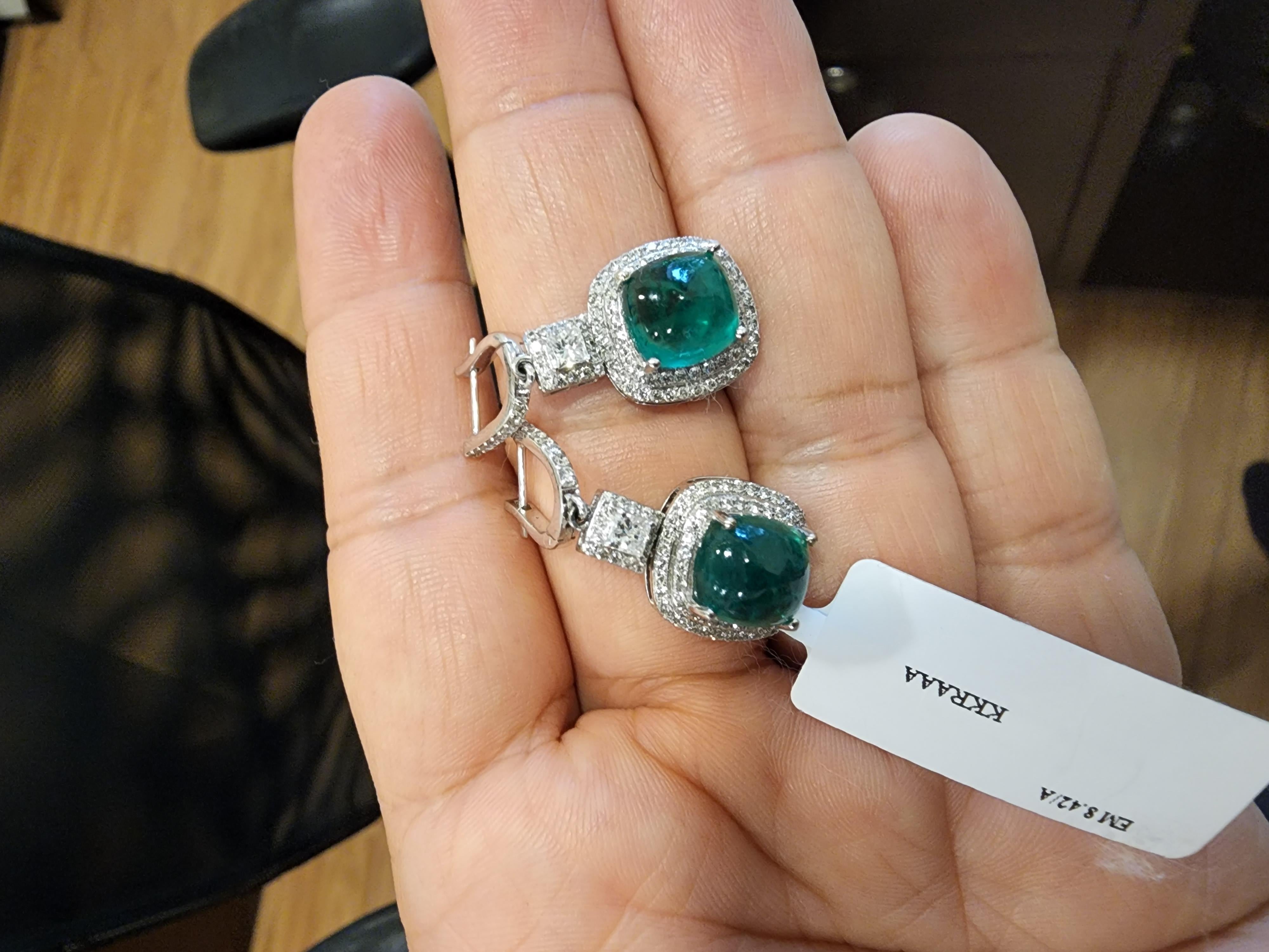 Emerald caboshans : 8.42 carats
Diamonds : 1.54carats
Gold : 6.113 (14k)

Emerald caboshans are of very high quality and very good quality diamonds

Its very hard to capture the true color and luster of the emerald , i have tried to add pictures