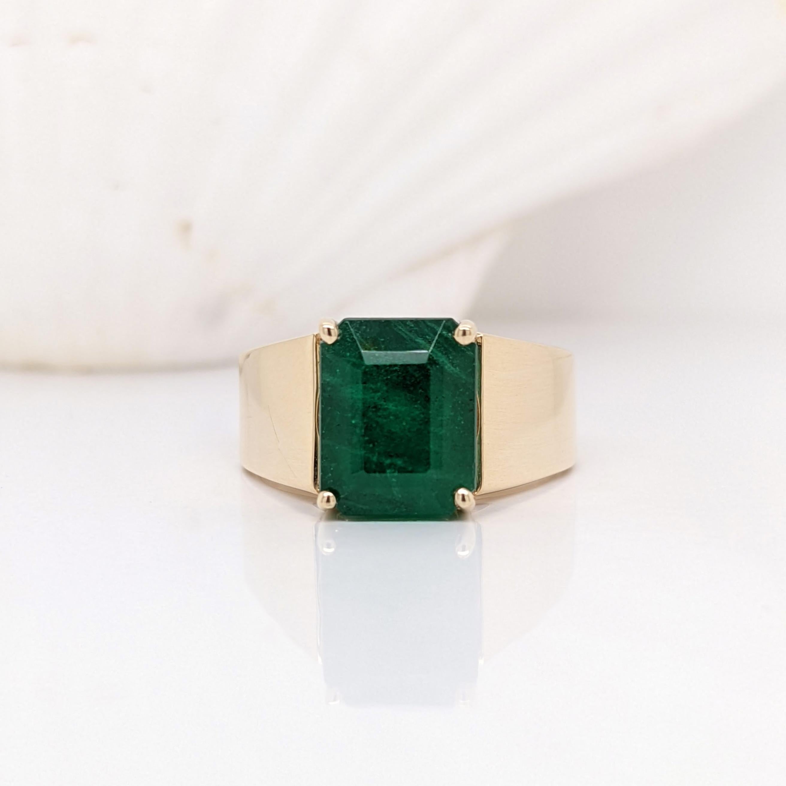 Stone Type: Emerald
Origin: Zambia
Treatment: Oiled
Hardness: 7.5
Shape: Emerald Cut
Size: 10x8mm
Weight: 6.84cts
Metal: Solid 14k/ 7.5gms
Sku: CigarBandRing/8436

This timeless cigar band ring features a high quality 10x8mm emerald, held perfectly