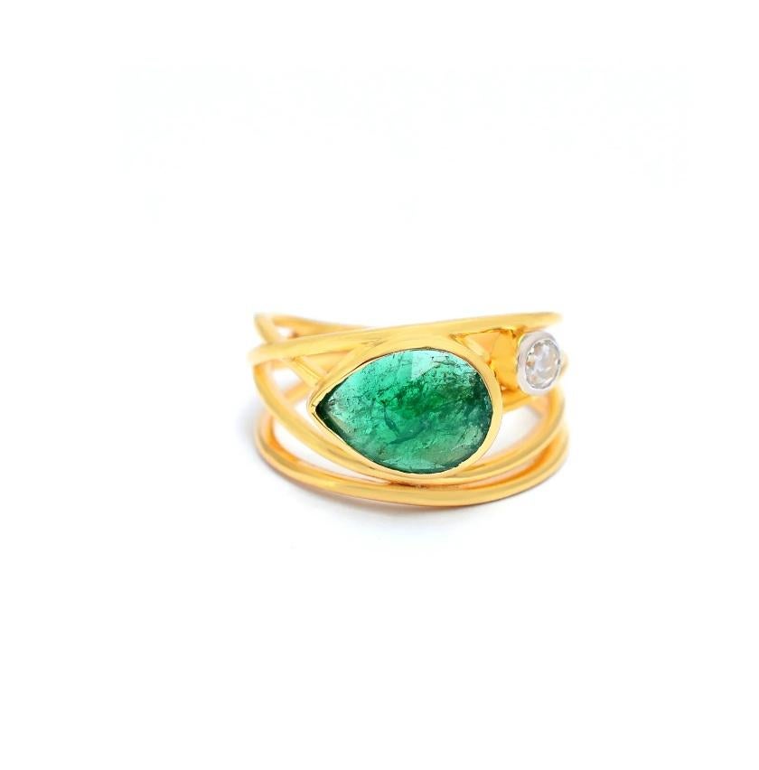 Dream on with our Khwaab ring made with 14K Solid Yellow Gold, 0.13 Carat Natural Diamond (G-H Color, SI1-SI2 Purity) and 1.89 Carat Emerald! The spiral design is a rarity to find with the rich finesse of the authentic gemstone!