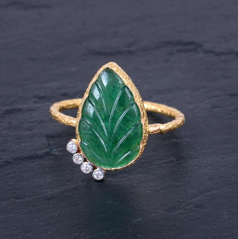 This Leaf textured design ring with 18K Solid Yellow Gold 0.04 Carat Natural Diamond (G-H Color, SI1-SI2 Purity) and Emerald Gemstone. This ring is the possession of a lifetime as its versatility and timelessness is never going to get