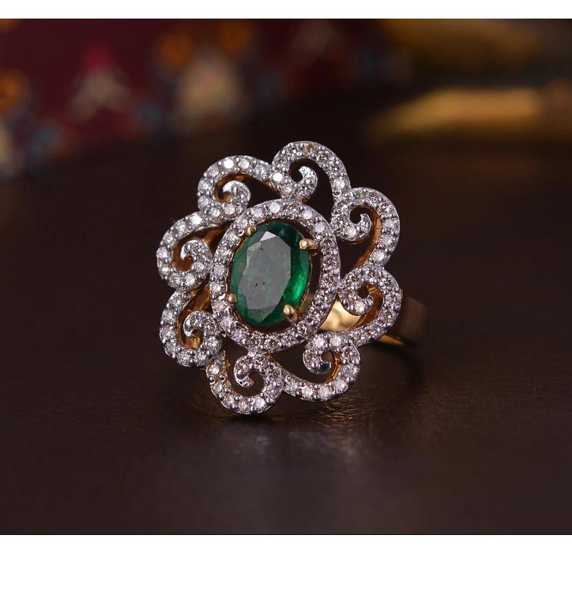 This floral ring is made of 18K yellow gold and features an emerald stone. It is handmade and is a beautiful addition to any jewelry collection. Embrace your love for this 18k yellow gold handmade ring. The design is so unique stylish. It would be
