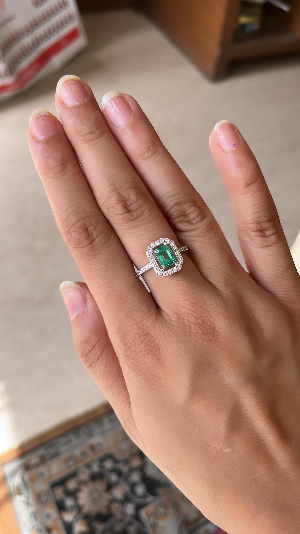 A very simple and beautiful Emerald Engagement Ring set in 18K White Gold & Diamonds. The weight of the Emerald is 1.03 carats. The Emerald is completely natural, without any treatment and is of Zambian origin. The weight of the Diamonds is 0.51