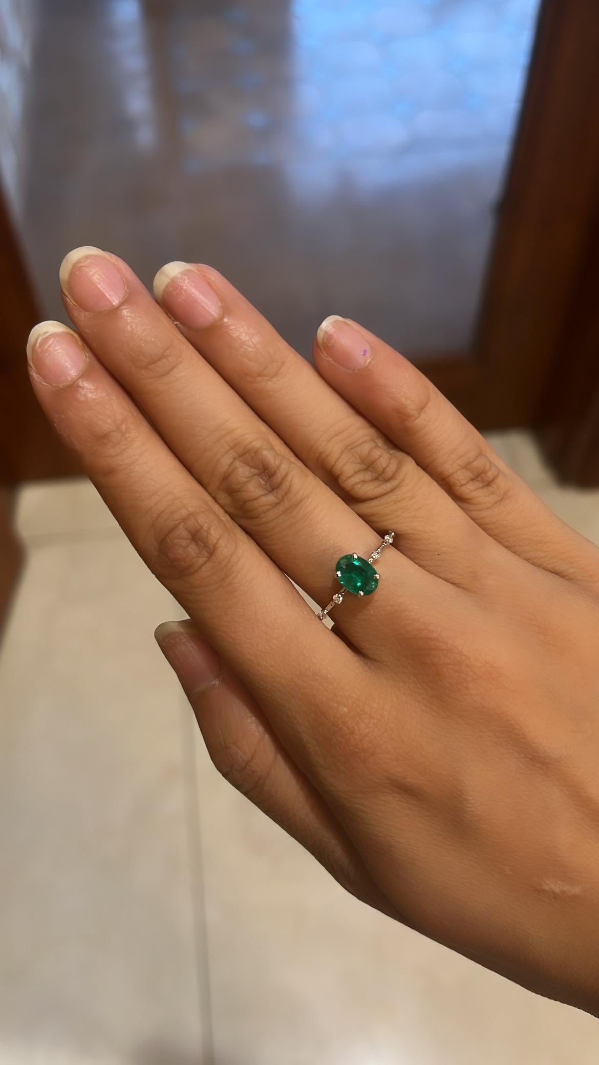 A very beautiful and gorgeous Emerald Engagement Ring set in 18K White Gold & Diamonds. The weight of the oval shaped Emerald is 1.01 carats. The Emerald is completely natural, without any treatment and is of Zambian origin. The weight of the