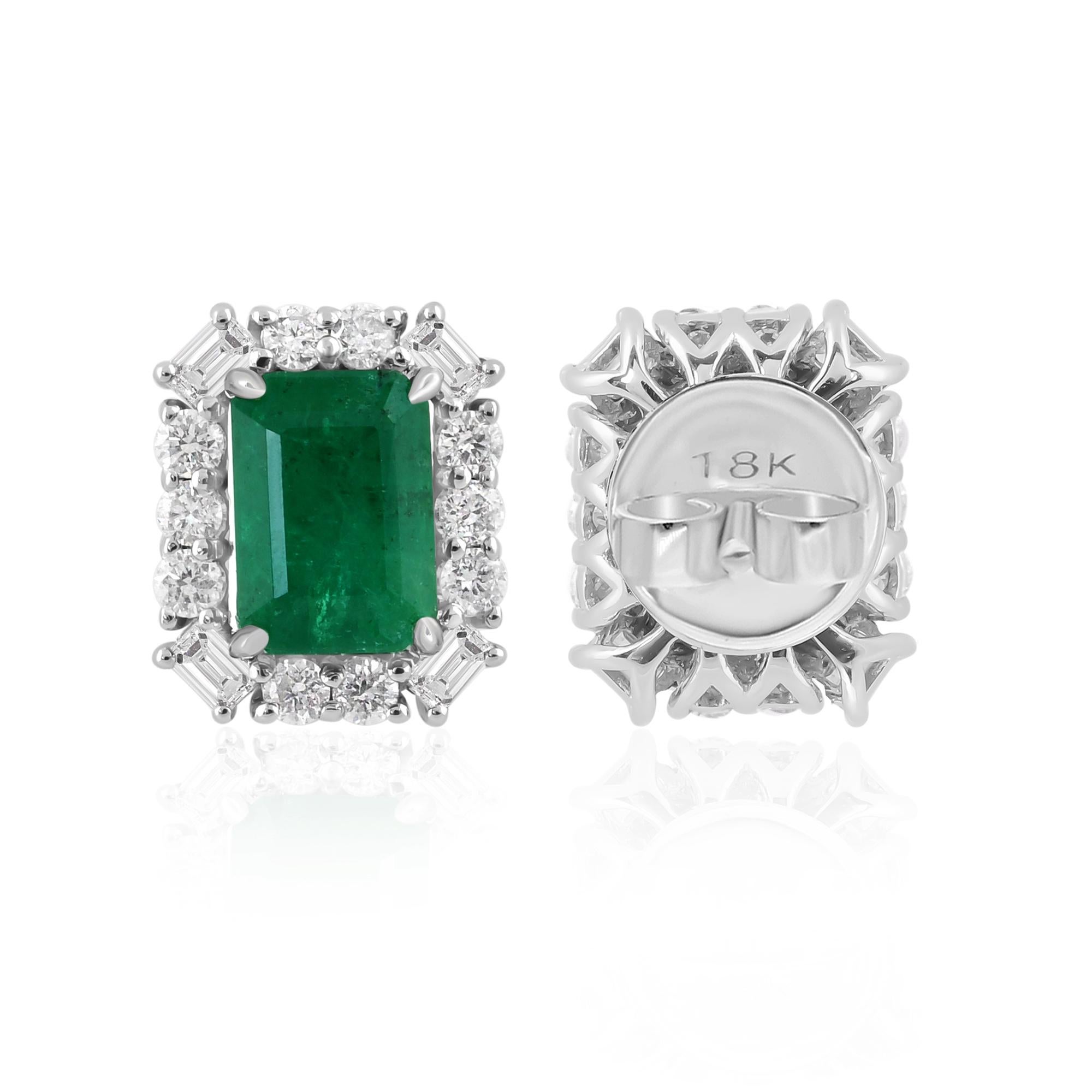 Step into a world of enchantment with these Zambian Emerald Gemstone Earrings, a masterpiece of handmade jewelry crafted in elegant 14 Karat White Gold. Radiating sophistication and allure, these earrings feature exquisite Zambian emeralds accented