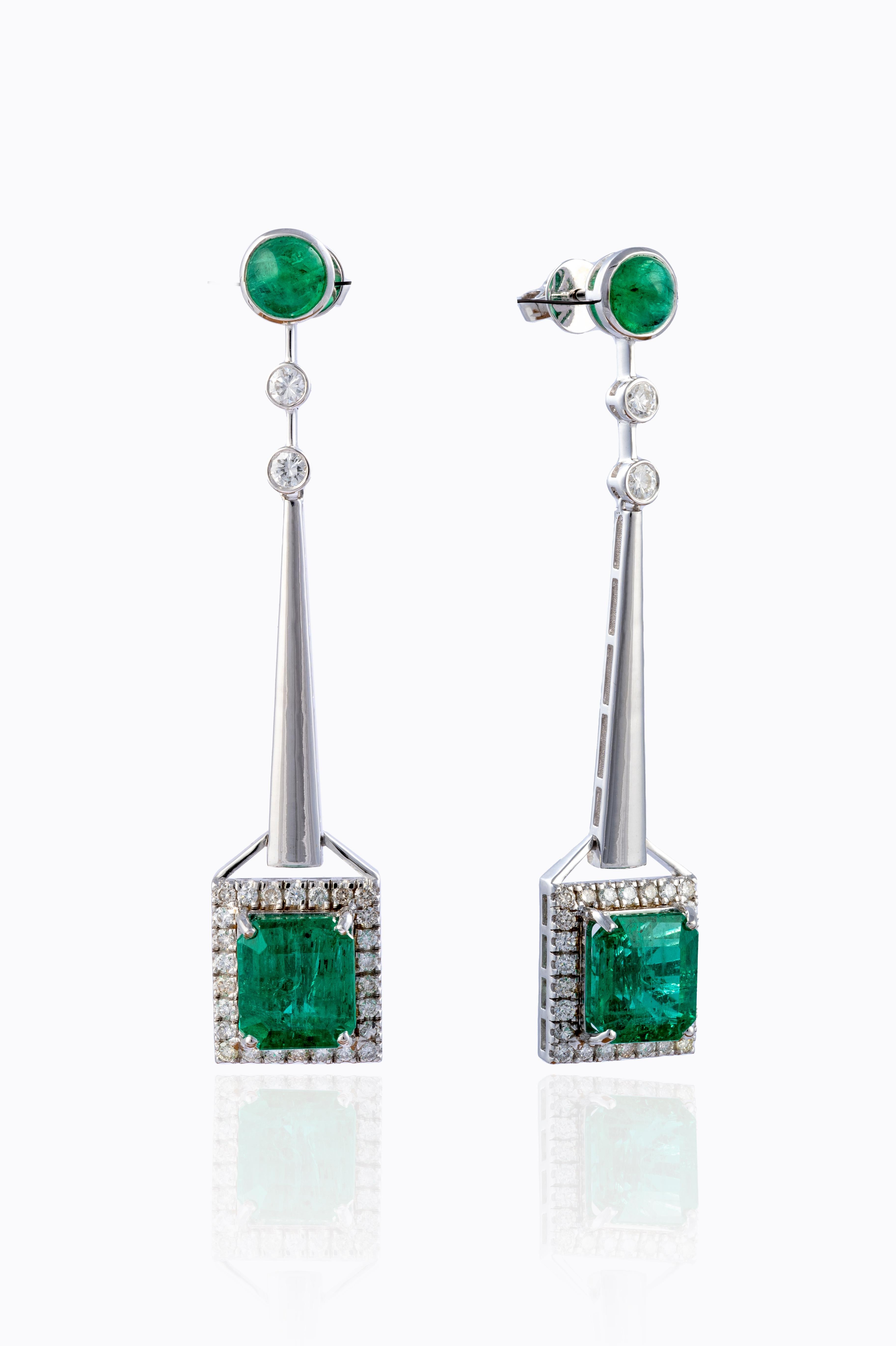 this is an elegant natural Zambian Emerald earrings with vsi clarity diamonds and G colour. the emeralds are of very high quality.

emeralds : 10.52 cts
diamonds: 1.32 cts.
gold : 9.58 gms
Its very hard to capture the true color and luster of the