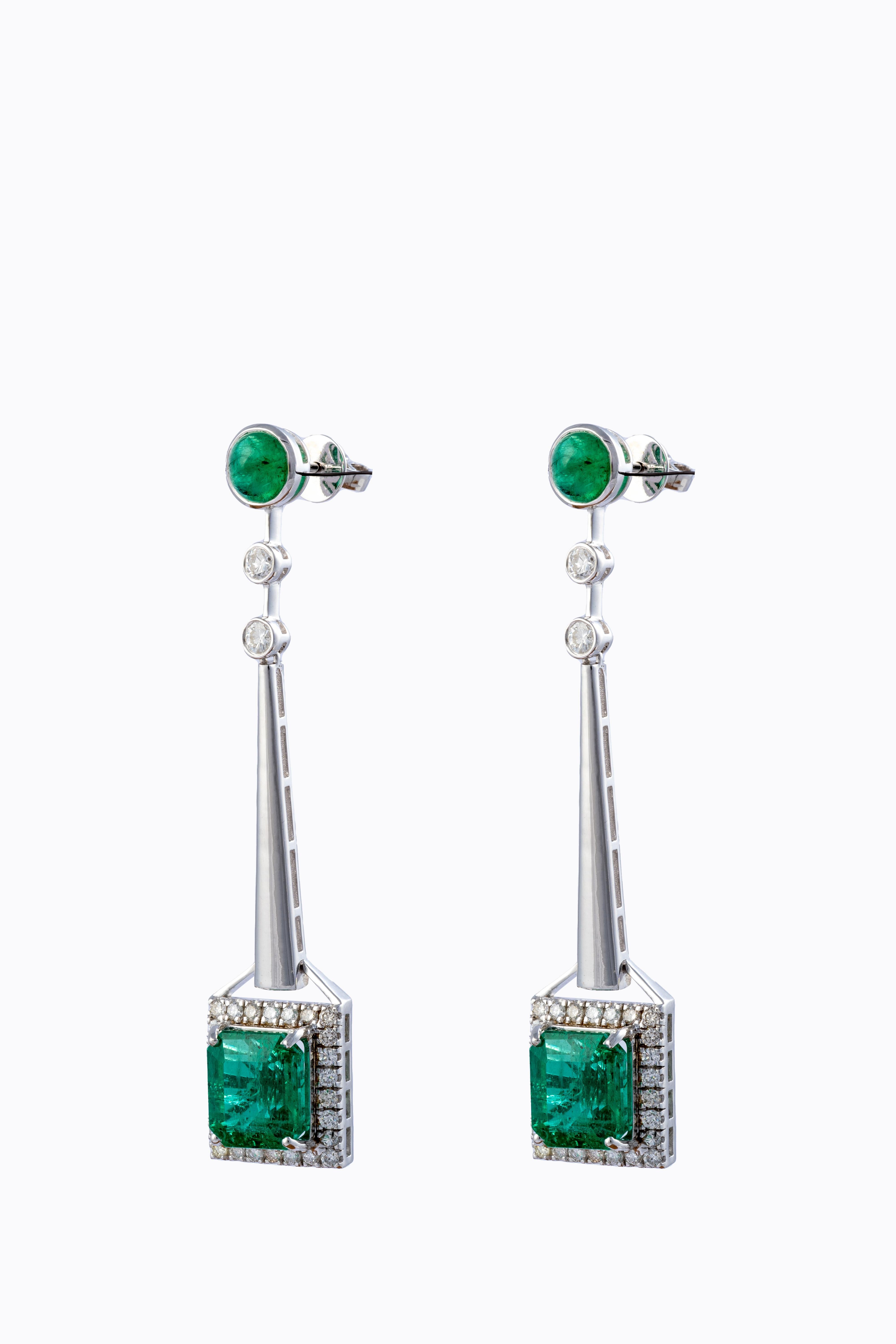 This is an elegant natural Zambian Emerald earrings with vsi clarity diamonds and G colour the 
emsrald are of very high quality
emeralds : 10.52cts
diamonds : 1.32cts
gold : 9.58gms 
very hard to capture the true color and luster of the stone, I