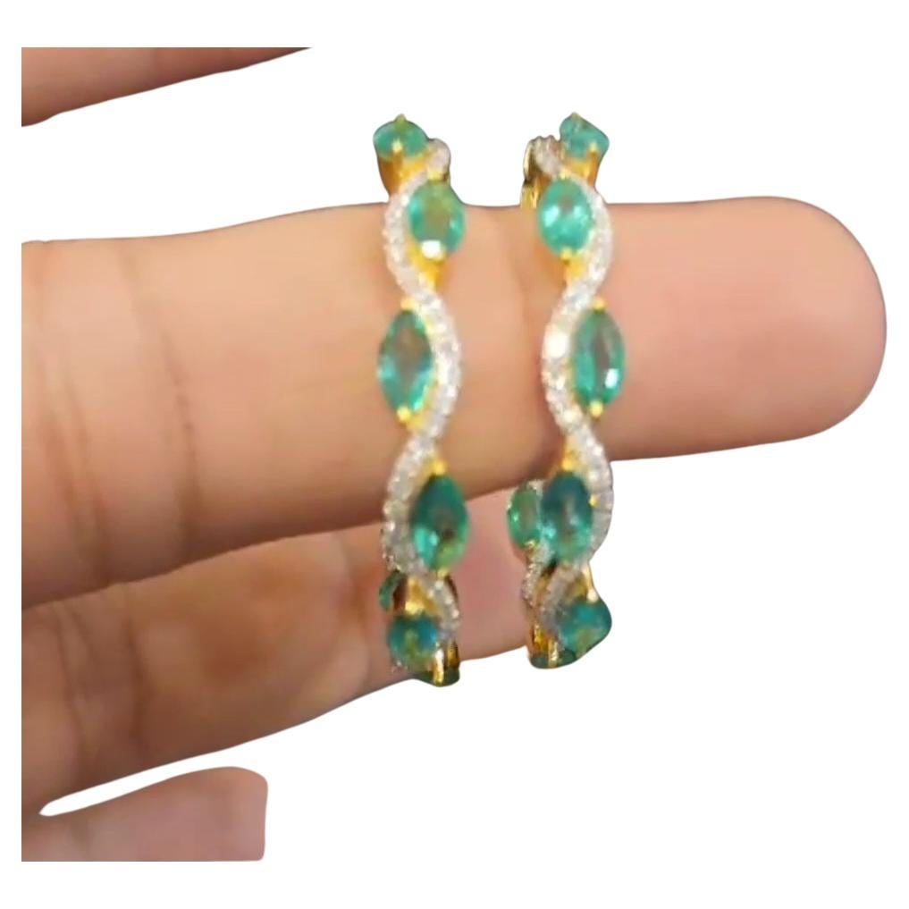 this is an amazing natural emerald and natural diamond earring. its in YELLOW GOLD POLISH. in pic it appears to be white gold.

emerald = 6.72 carats
diamonds =  1.38 carats
gold = 16.18 gms

FOLLOW MonalisaJewelry Inc. storefront to view the latest