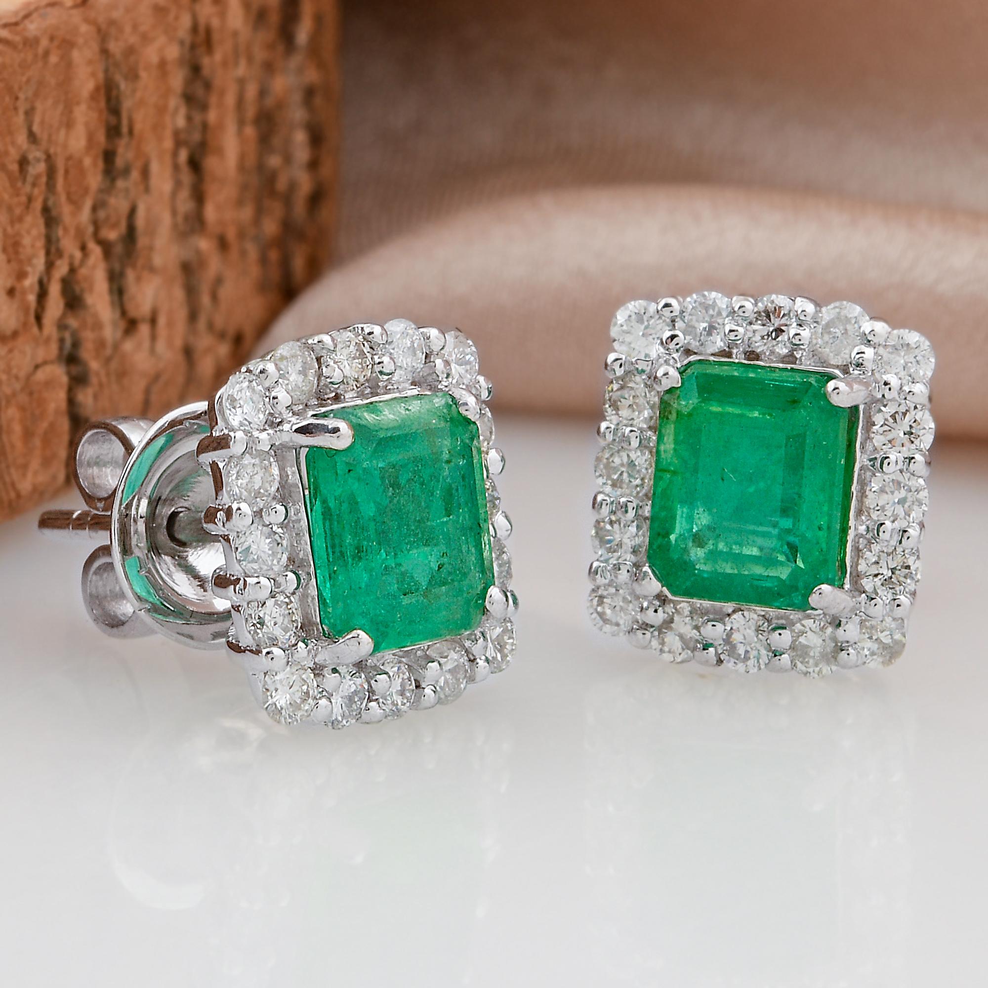 Crafted in 14 Karat White Gold, the setting of these earrings enhances their elegance and timelessness. The lustrous white gold perfectly complements the rich green of the emeralds and the brilliance of the diamonds, creating a harmonious and