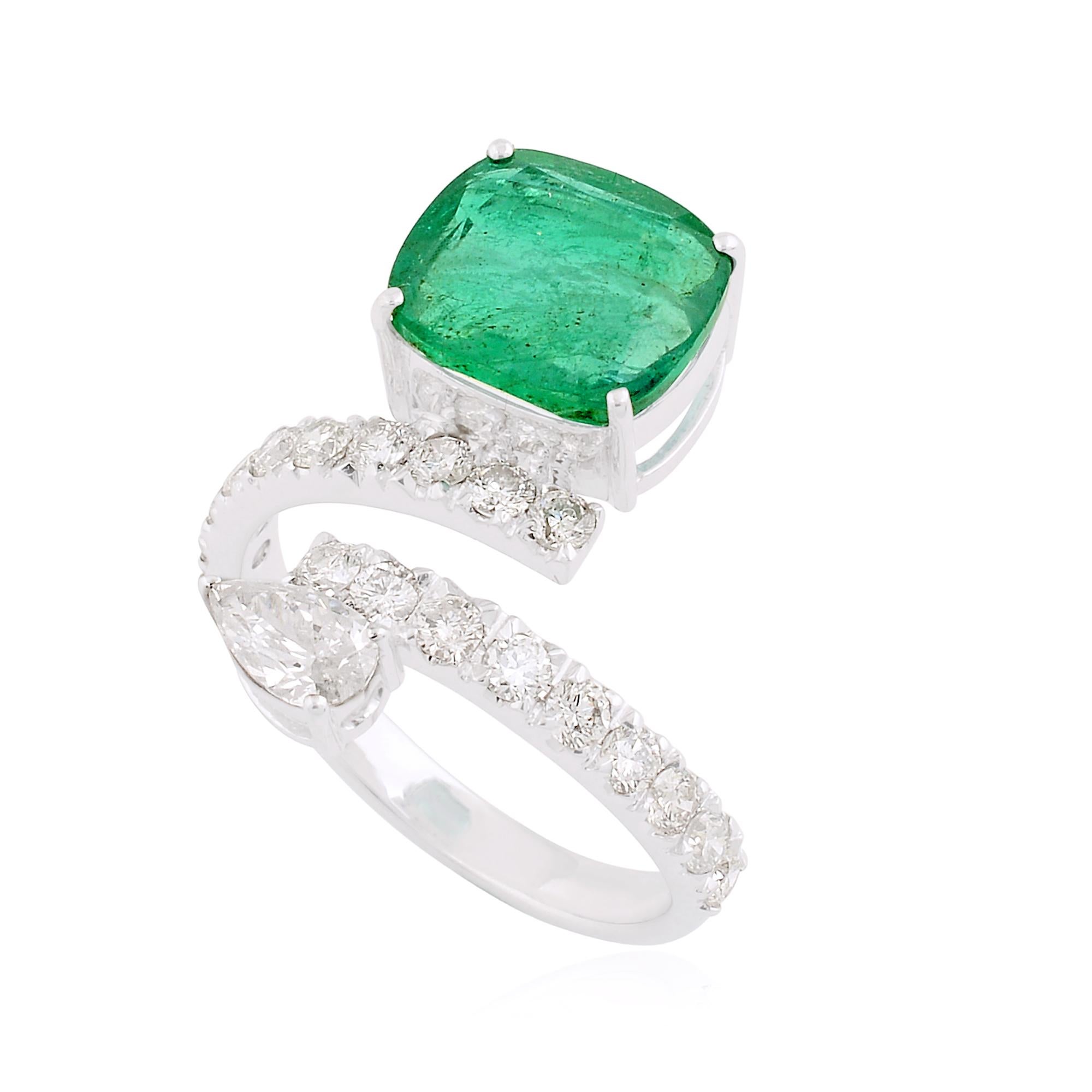 Crafted with precision and attention to detail, the ring is fashioned in solid 14 Karat White Gold, adding a timeless elegance to the design. The white gold setting provides the perfect backdrop for the emerald and diamonds, creating a harmonious