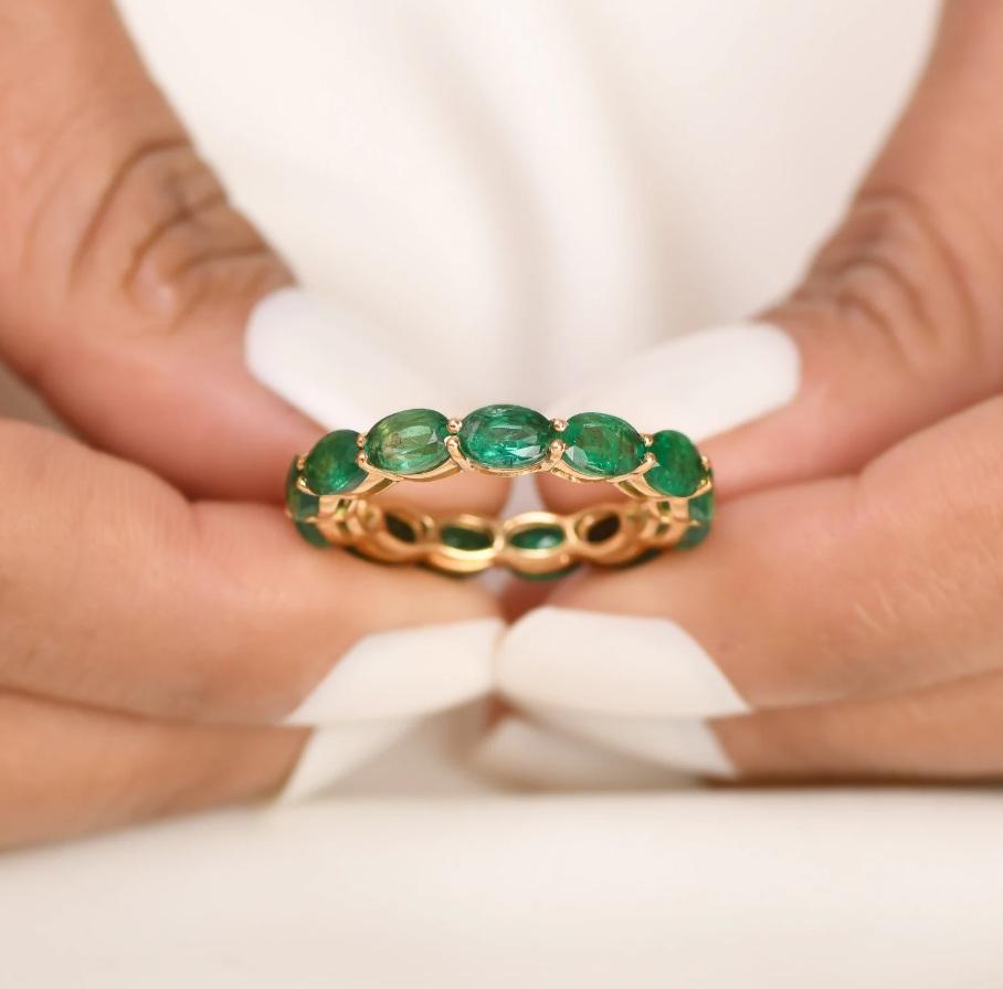 Emerald oval east west prong set eternity band ring gold  Natural 7CT 4MM wide emerald oval eternity band gold  Emerald cut emerald ring

STONE DETAILS :
✦ Gemstone : Emerald
✦ Gemstone Type : Natural
✦ Gemstone Size : 6x4MM
✦ Gemstone Shape :