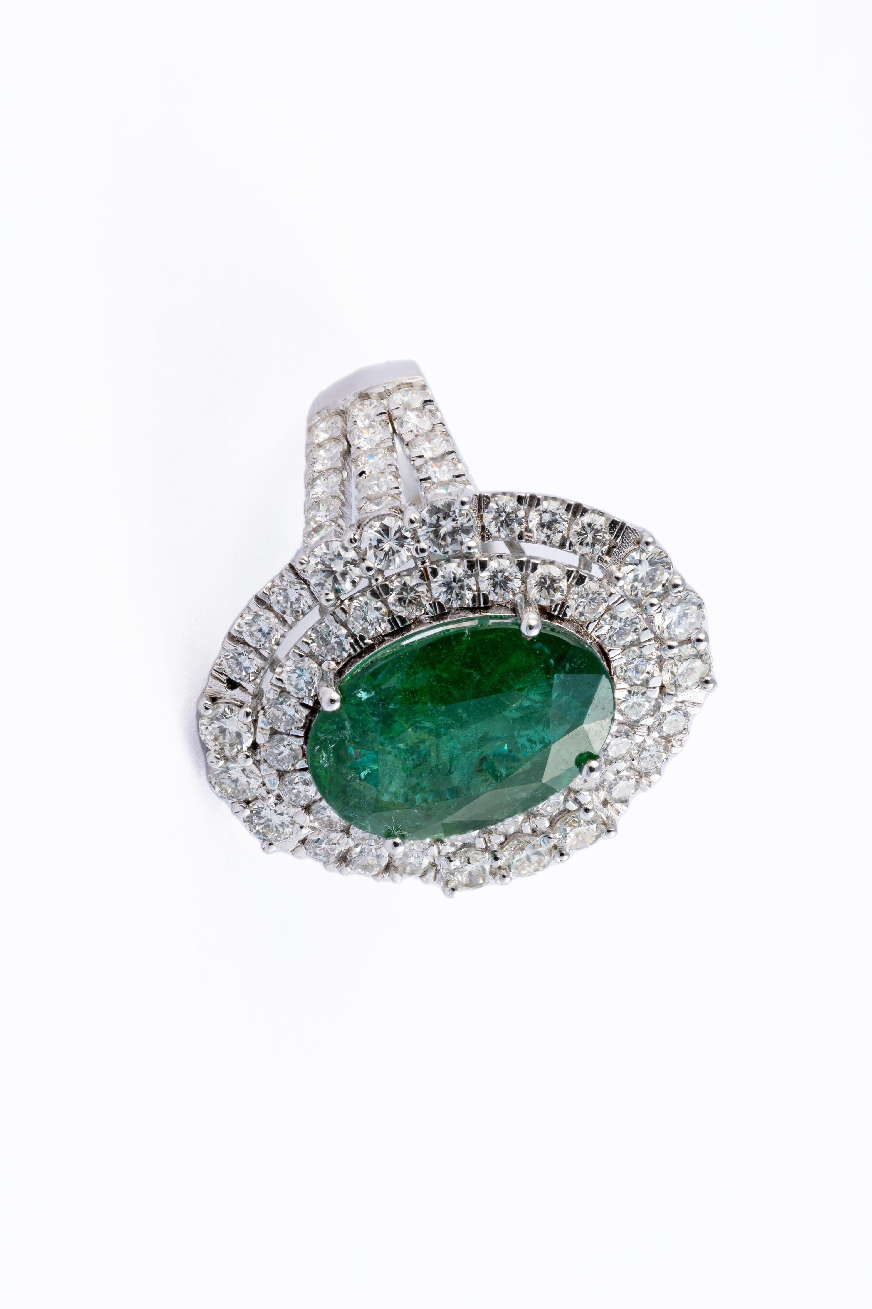 this is a stunning natural Zambian Emerald  ring with very high quality Emerald and very good quality diamonds ( vsi ) and G colour

emeralds : 5.97cts
diamonds: 2.74cts
gold :7.048gms
