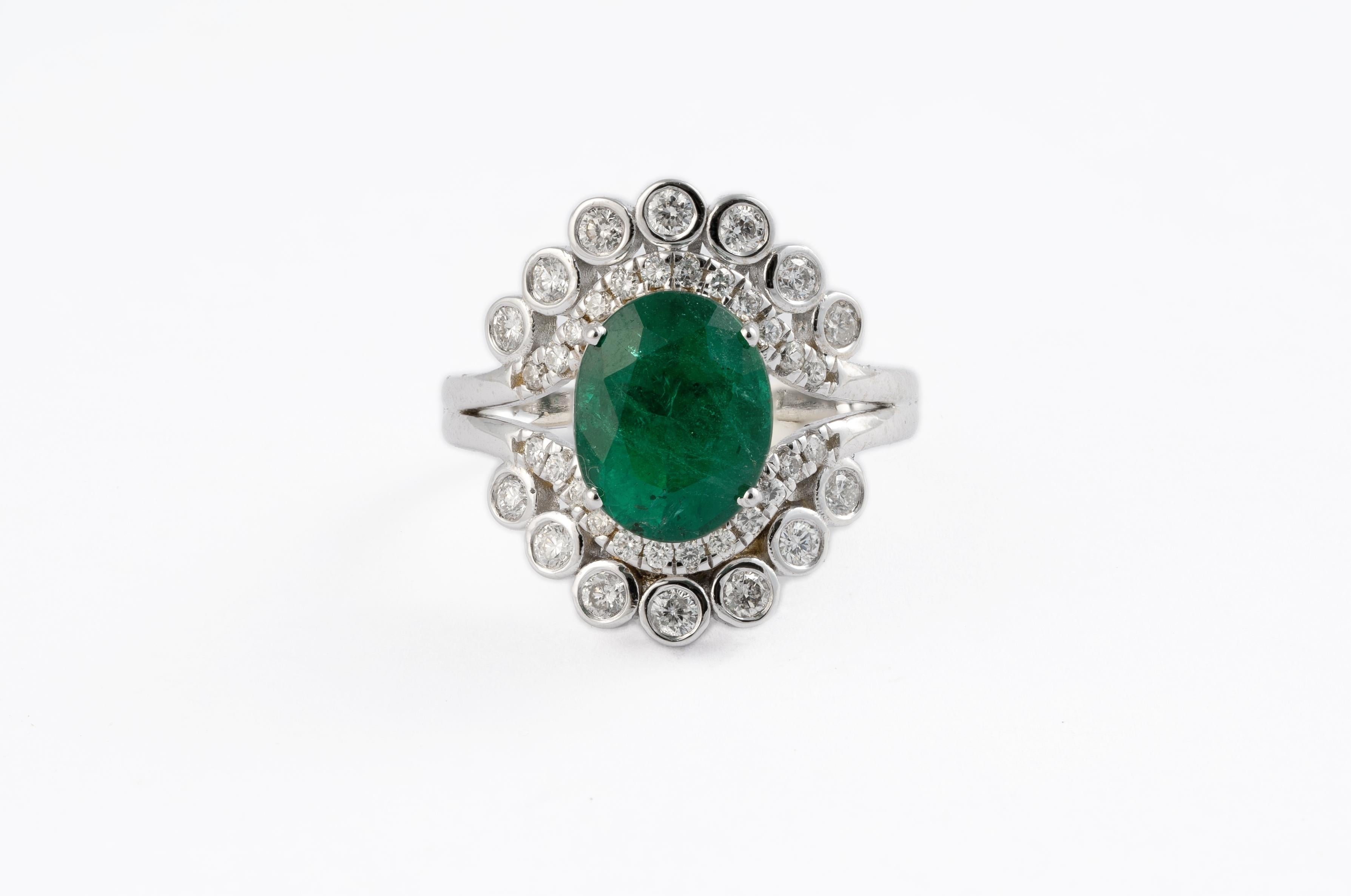 This is an amazing everyday wear ring with high quality Zambian natural emerald and very good 
clarity diamonds which are vsi in clarity and G colour 
emeralds: 2.96cts
diamonds :0.65cts
gold : 5.88gms
very hard to capture the true color and luster