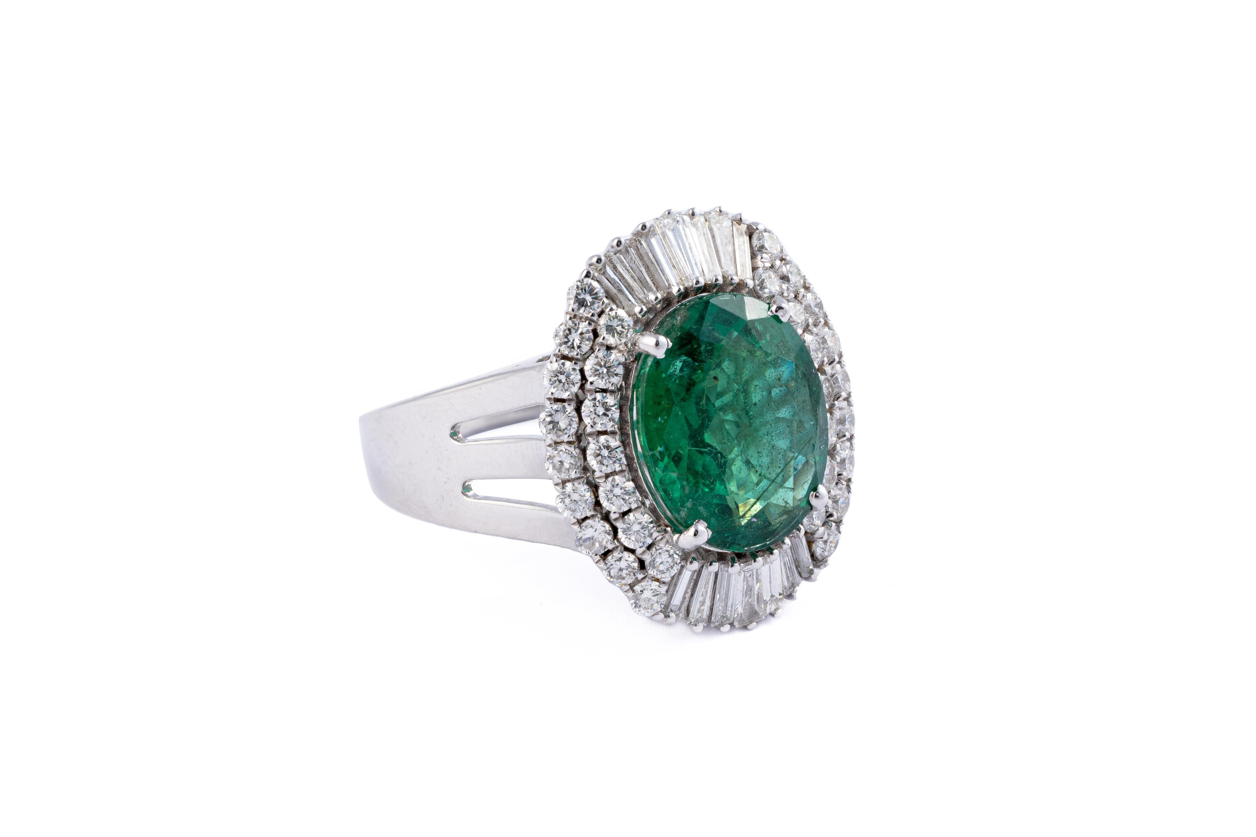 This is a natural Zambian Emerald ring with diamonds and 14k gold the emeralds are very high quality and very good quality diamonds the clarity is vsi and G colour 
emeralds : 4.54cts
diamonds : 1.47cts
gold : 7.39 gms
very hard to capture the true