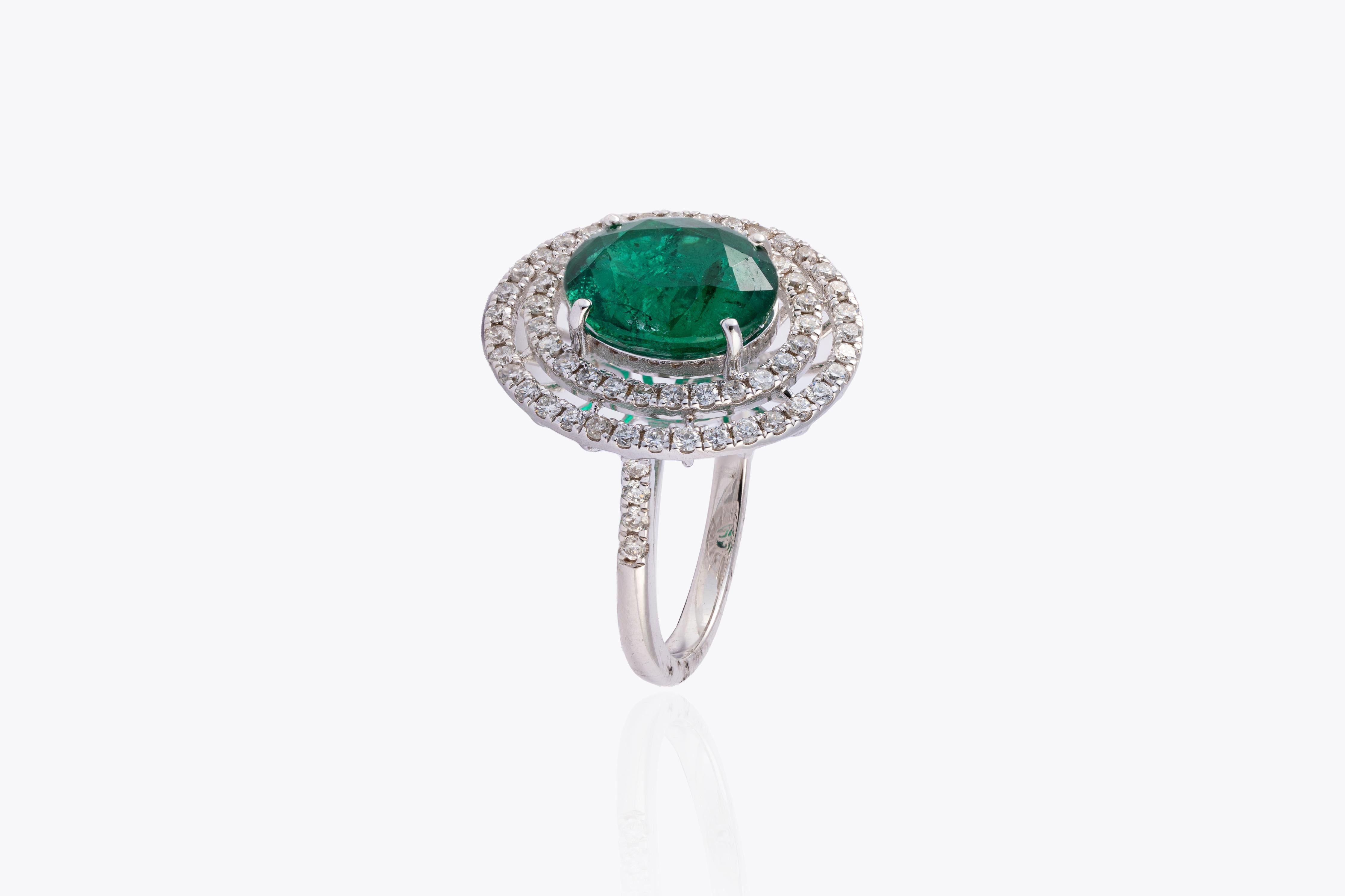 This is a stunning Natural Zambian Emerald ring with very high quality Emerald and very good quality diamonds vsi and G Colour 
emerald :5.97cts
diamonds :2.74cts
gold :7.048gms
very hard to capture the true color and luster of the stone, I have