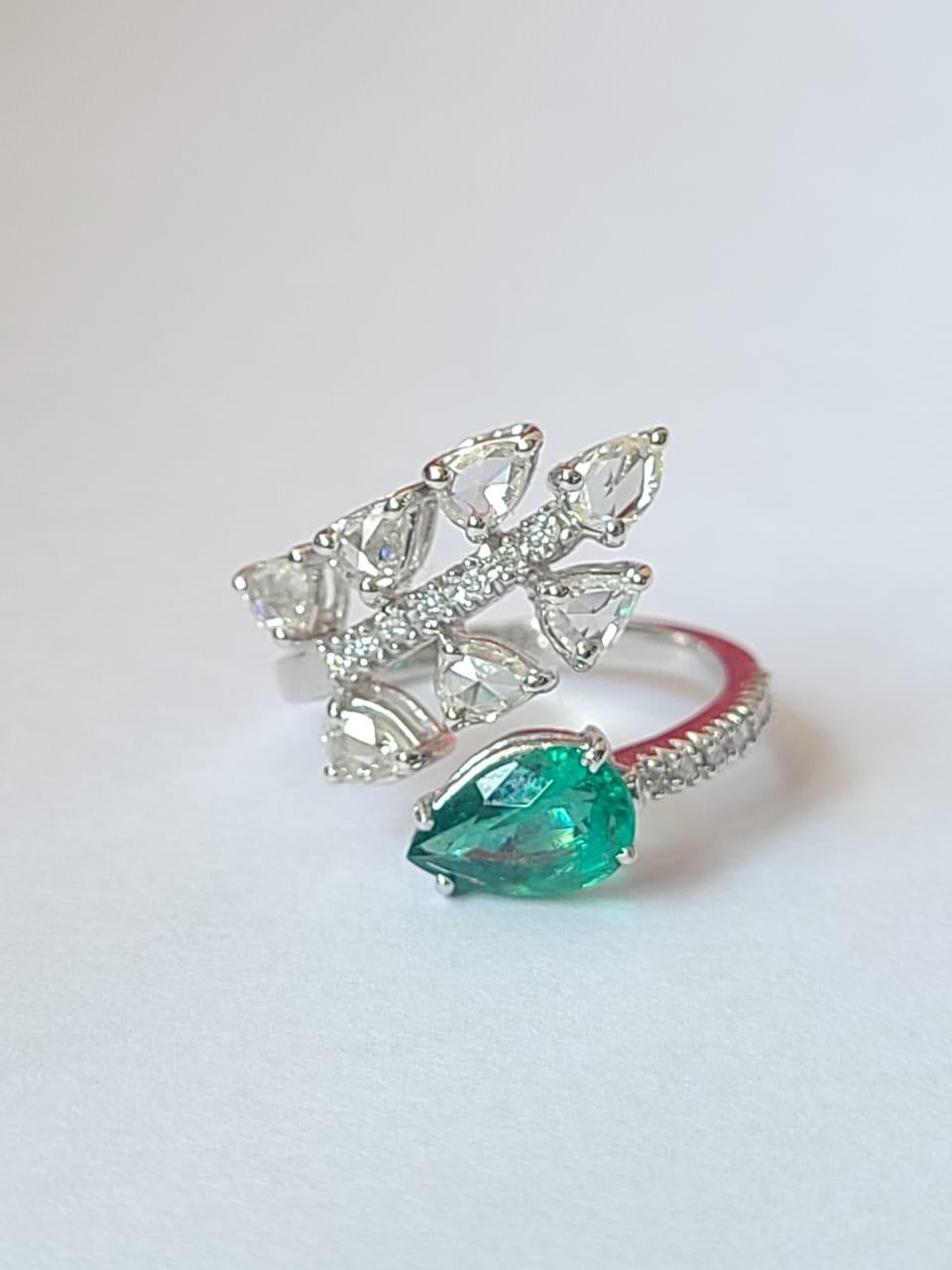 A very gorgeous and beautiful Emerald Engagement Ring set in 18K White Gold & Diamonds. The weight of the Pear shaped Emerald is 1.12 carats. The Emerald is of Zambian origin and is completely natural, without any treatment. The weight of the Rose