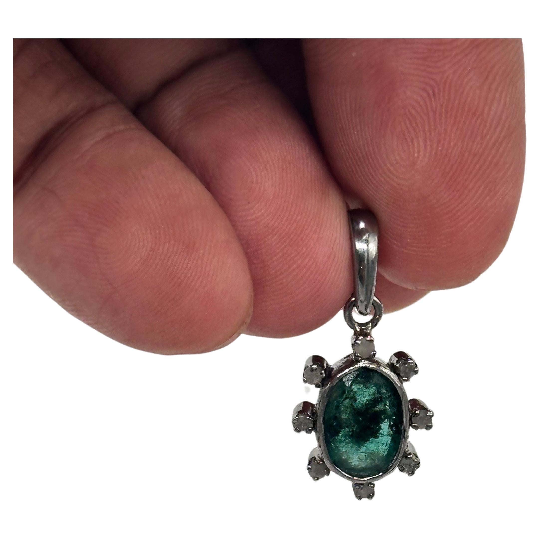 This Stunner Pendant defines class. It completes your everyday look and will also attract special attention on special occasions. This piece of beauty comprises of Certified Natural Zambian Emerald studded in 925 Sterling Silver with Certified Pave