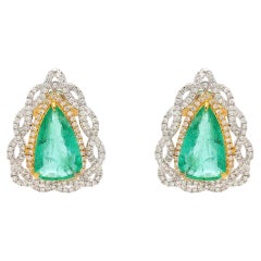 Nature Zambienne  Boucle d
oreille en or 18k avec émeraude et diamant