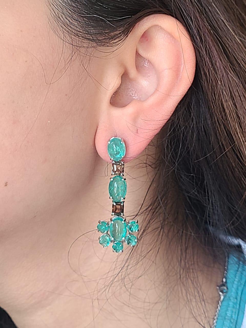 A very beautiful and one of a kind, Emerald Chandelier Earrings set in 18K White Gold & Diamonds. The weight of the Columbian Emerald Cabochons is 15.78 carats. The Emeralds are completely natural, without any treatment and are of Columbian origin.