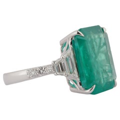 Radiant 6.40ct Zambian Emerald & 0.60ct Diamond Halo Ring in 18k Gold