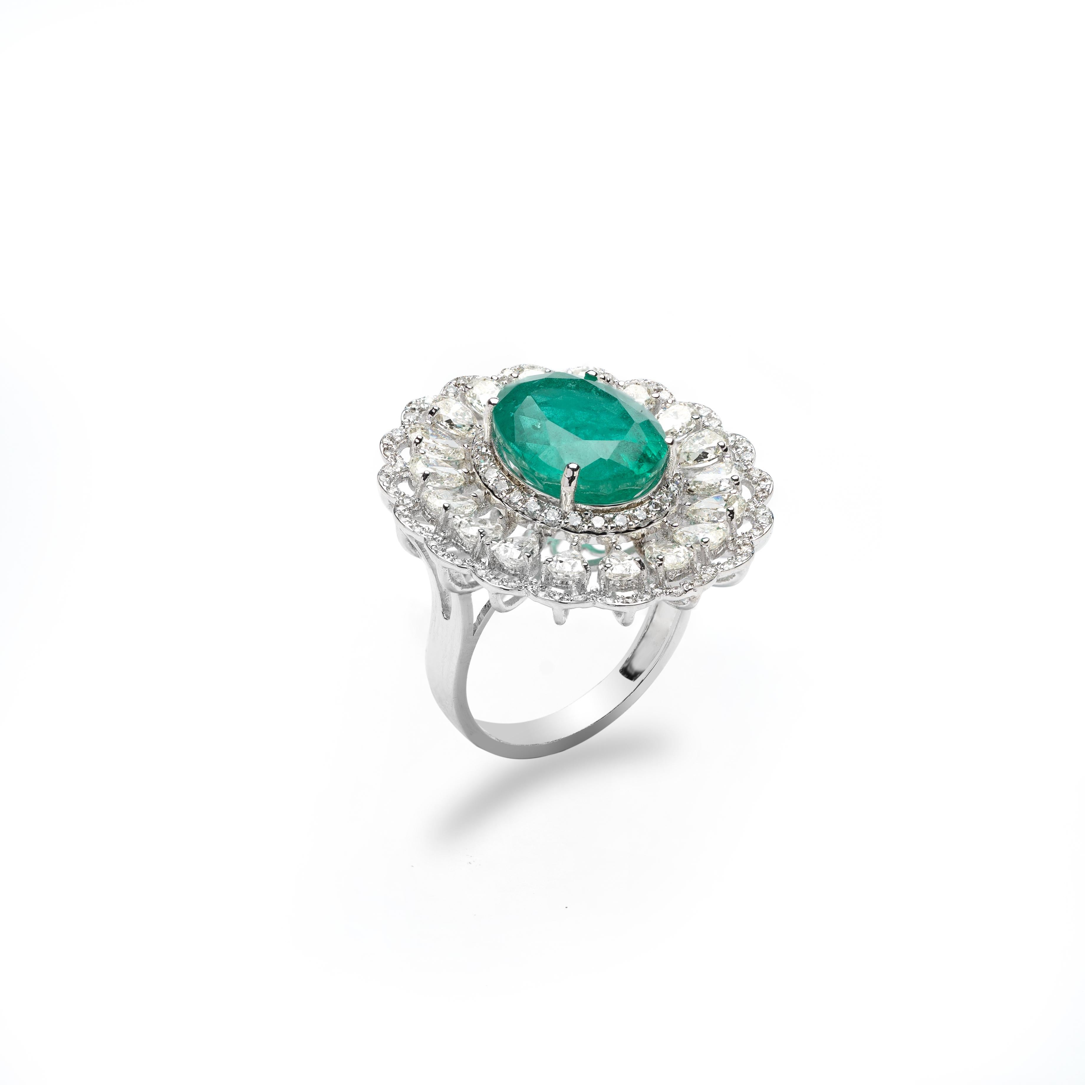 
Natural Zambian Emerald ring

 6.30 Carats of emeralds  
 3.11 Carats  of Diamonds

Emeralds are of very high quality. It's a brand new piece.

It’s very hard to capture the true color and luster of the stone, I have tried to add pictures which are