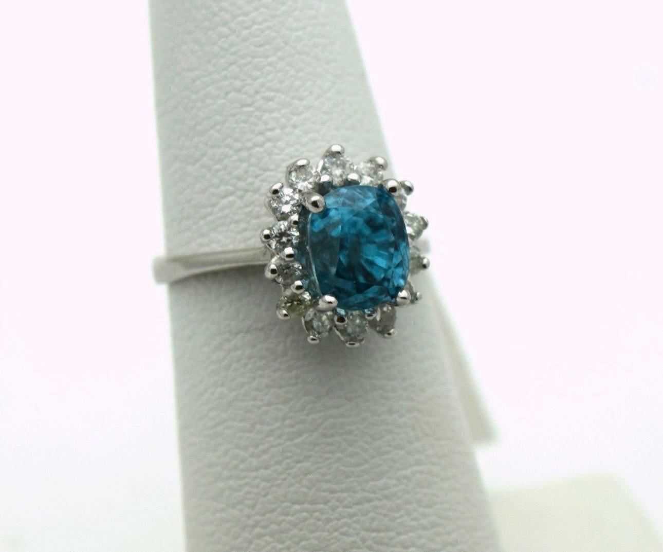 Natural zircon diamond ring, zircon is a rare gemstone that is most commonly known for its mesmorizing turquise color, the depth is really beautiful! This ring is made in 18KT white gold with a halo of natural VS diamonds F color in size 6. Diamonds
