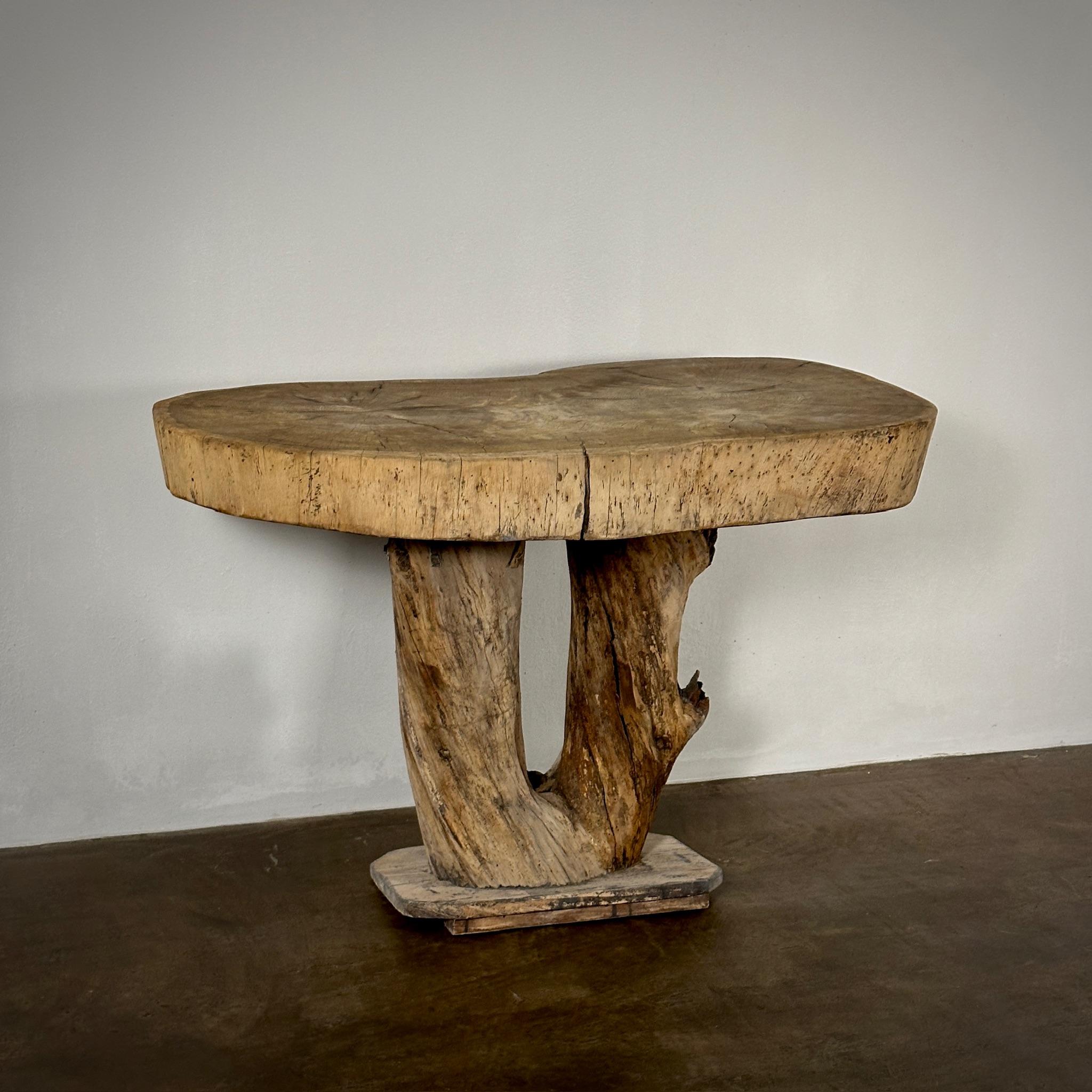 Early 20th century French naturalist end or accent table with live edge wood surface and natural wood base. Rustic and graceful in equal measure.

France, circa 1910

Dimensions: 42.5W x 24D x 29H