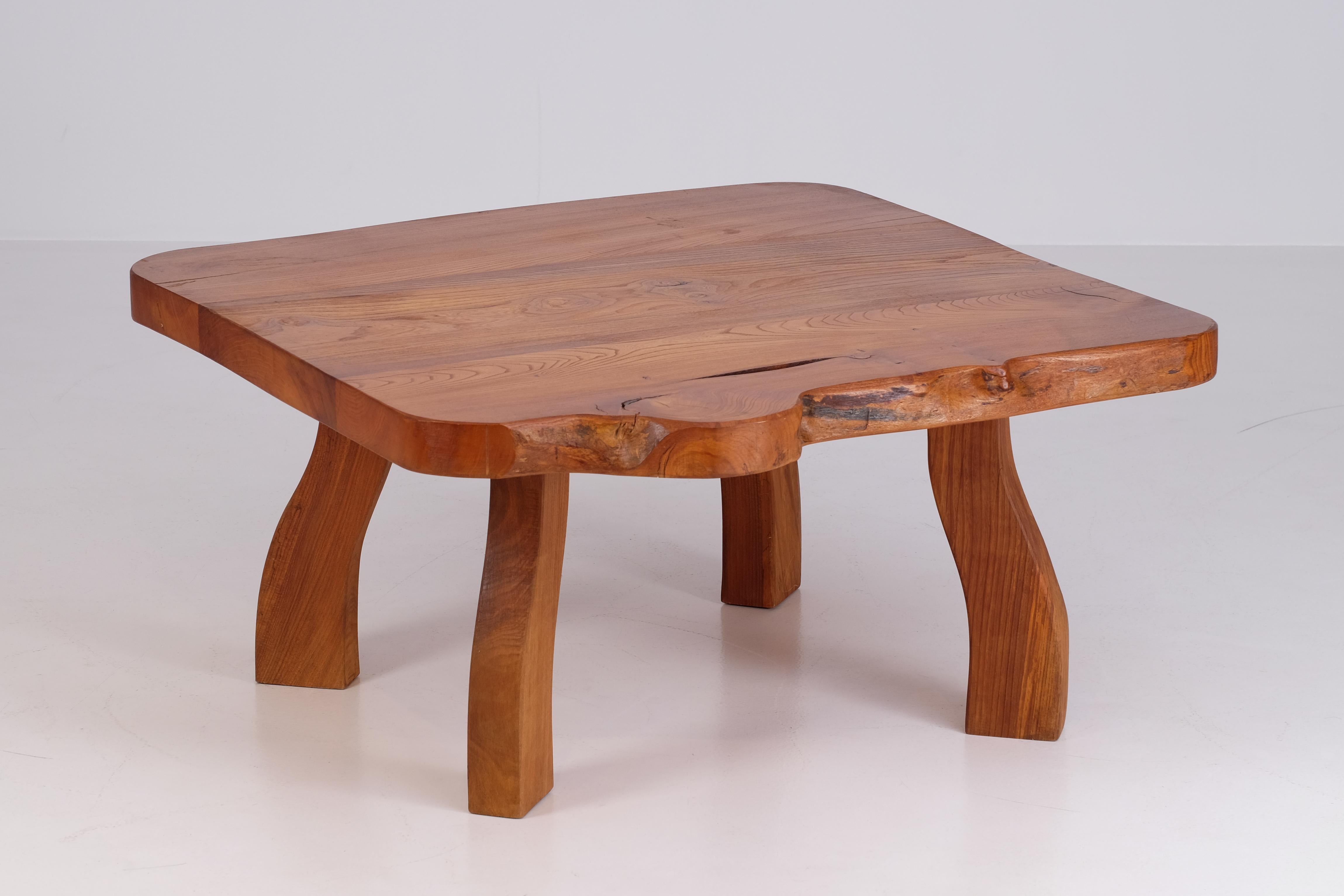 A lovely and rare naturalistic shaped coffee table / long bench / side table in elm. Produced by C. A. Beijbom, 1967, Sweden.