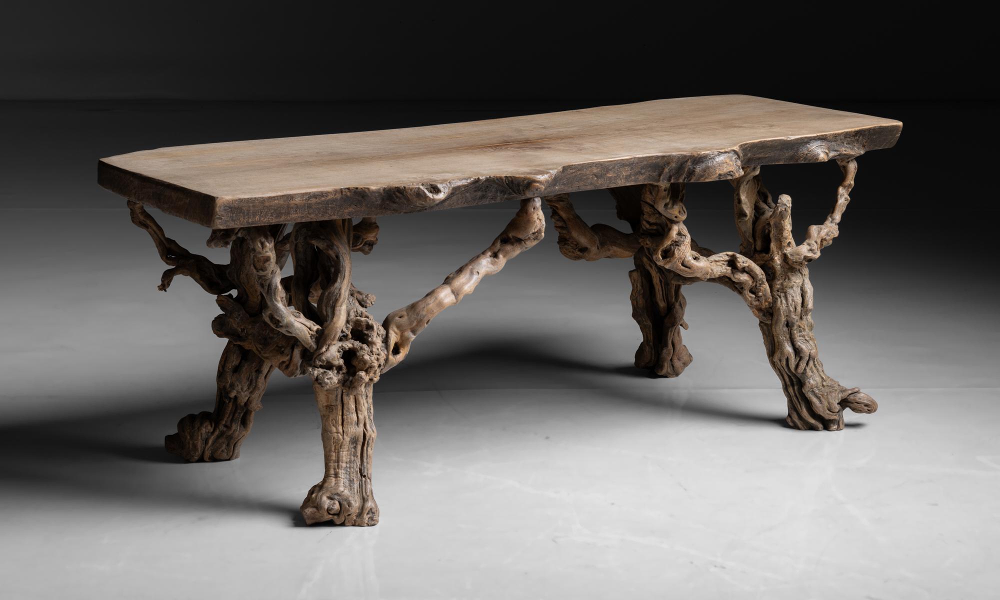 Naturalistic Elm Coffee Table

France circa 1950

Slab top on root legs.

Measures 49.5