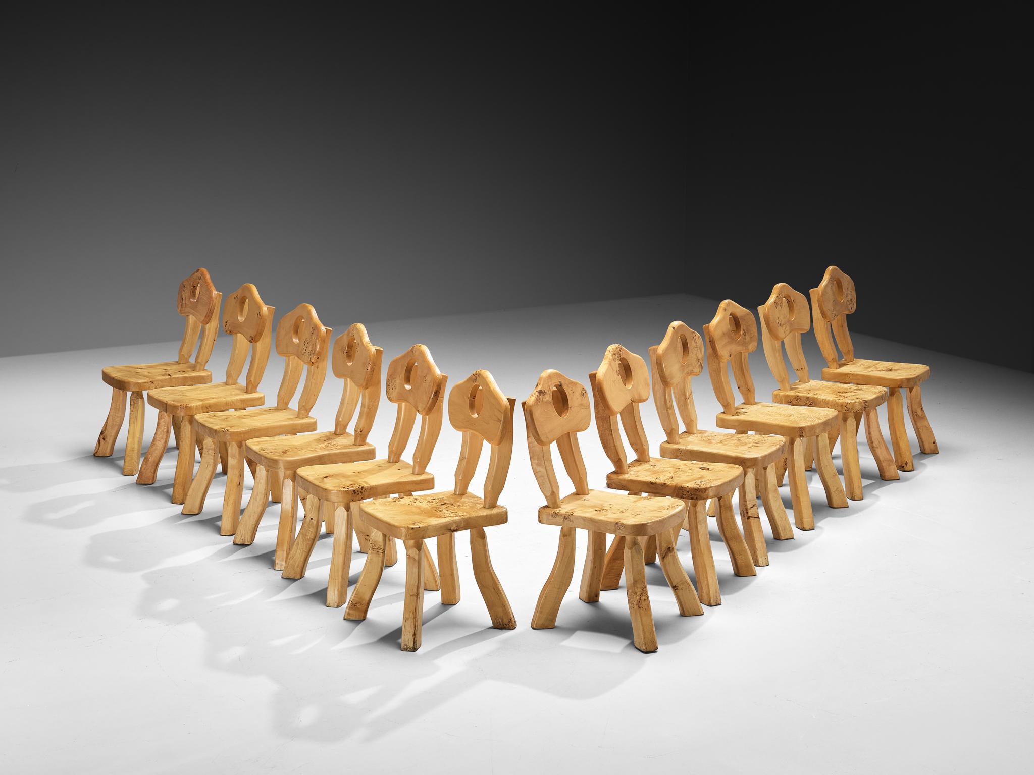 Set of twelve dining chairs, maple, Europe, 1970s

These maple chairs from the 1970s have an unmistakably raw and whimsical feel, as if they have wandered straight from the pages of a storybook or emerged from a woodland cottage tucked deep in the