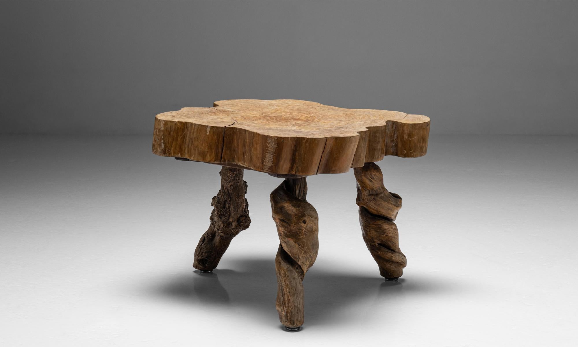 Naturalistic table

England Circa 1920

Slab tree trunk table top with burl root legs.

Measures: 30.5”W x 27”D x 19.5”H.