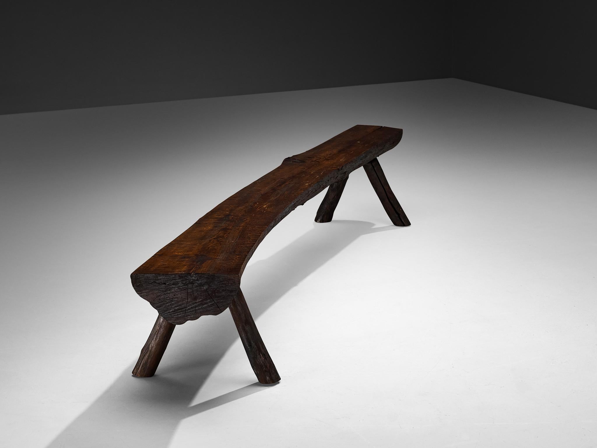 Large bench, wood, Italy, 1960s

This remarkable large bench, crafted in Italy in the 1960s, exemplifies naturalistic design. Sculpted from a single slab of wood, the bench showcases the organic beauty of its material. Its seat reveals the natural