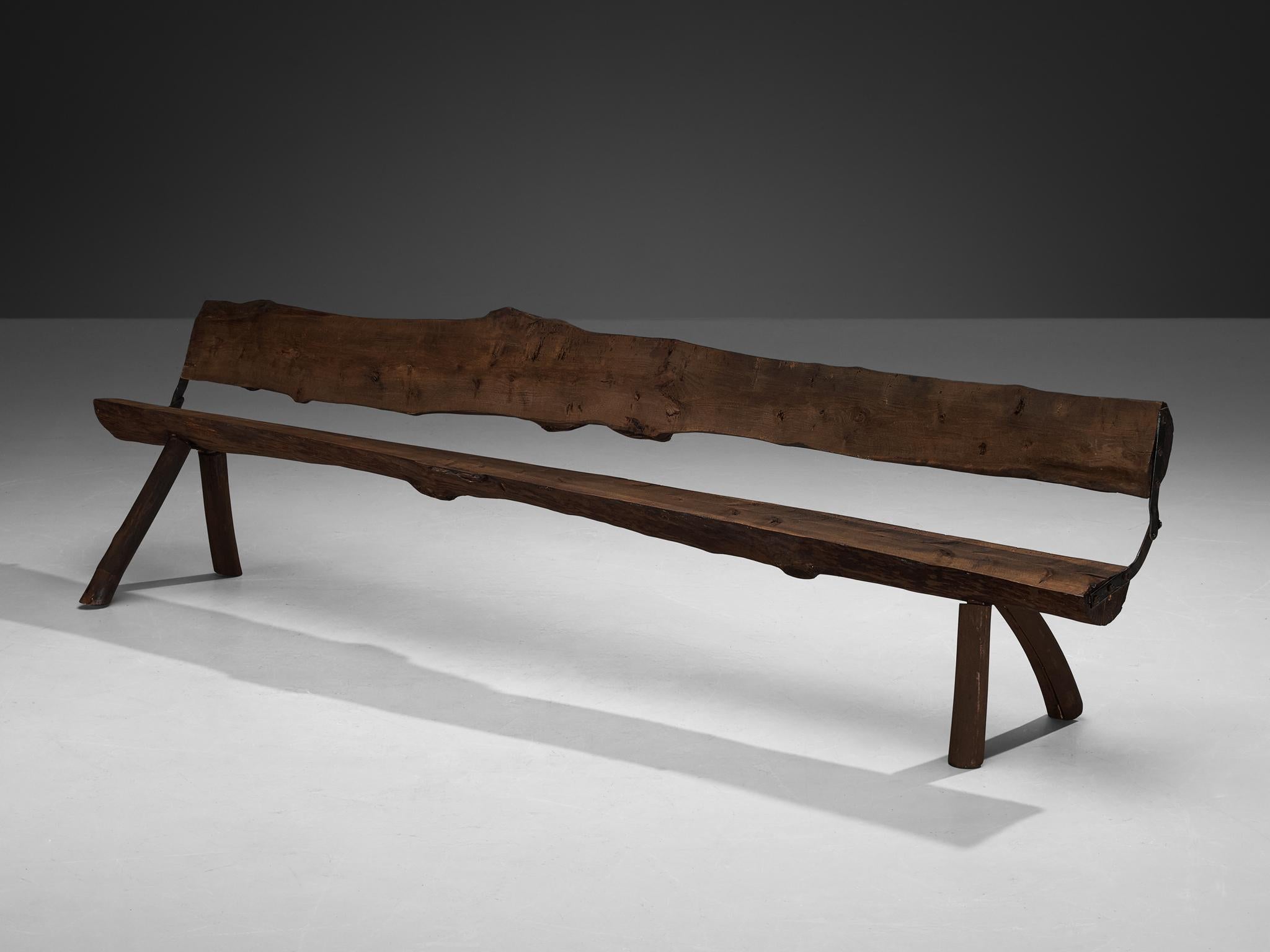 Large foldable bench, beech, iron, Italy, 1960s

This remarkable large bench, crafted in Italy in the 1960s, exemplifies naturalistic design. Sculpted from single slabs of wood, the bench showcases the organic beauty of its material. Its seat and